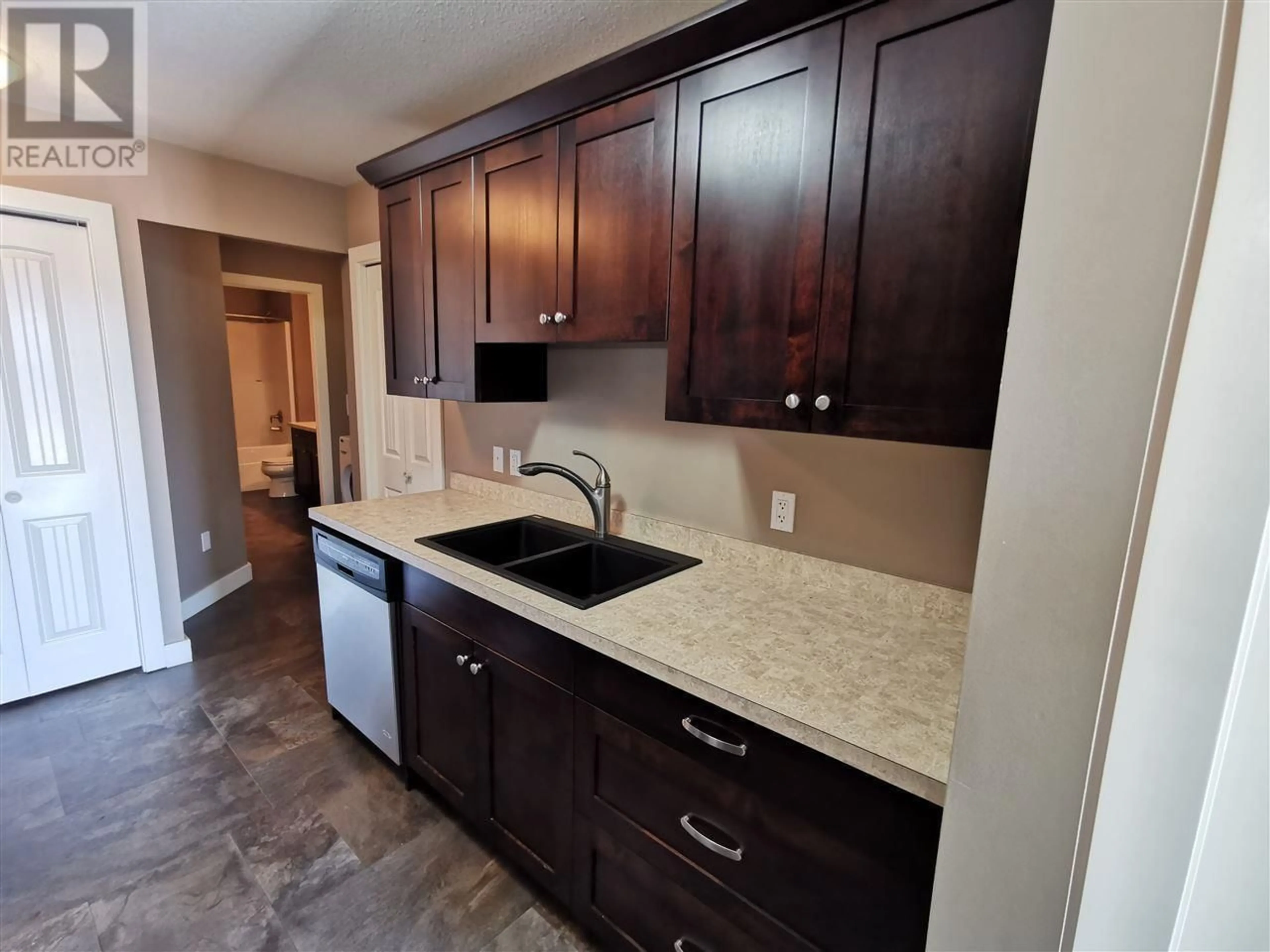 Open concept kitchen, ceramic/tile floor for 4 10220 97 AVENUE, Fort St. John British Columbia V1J0B1