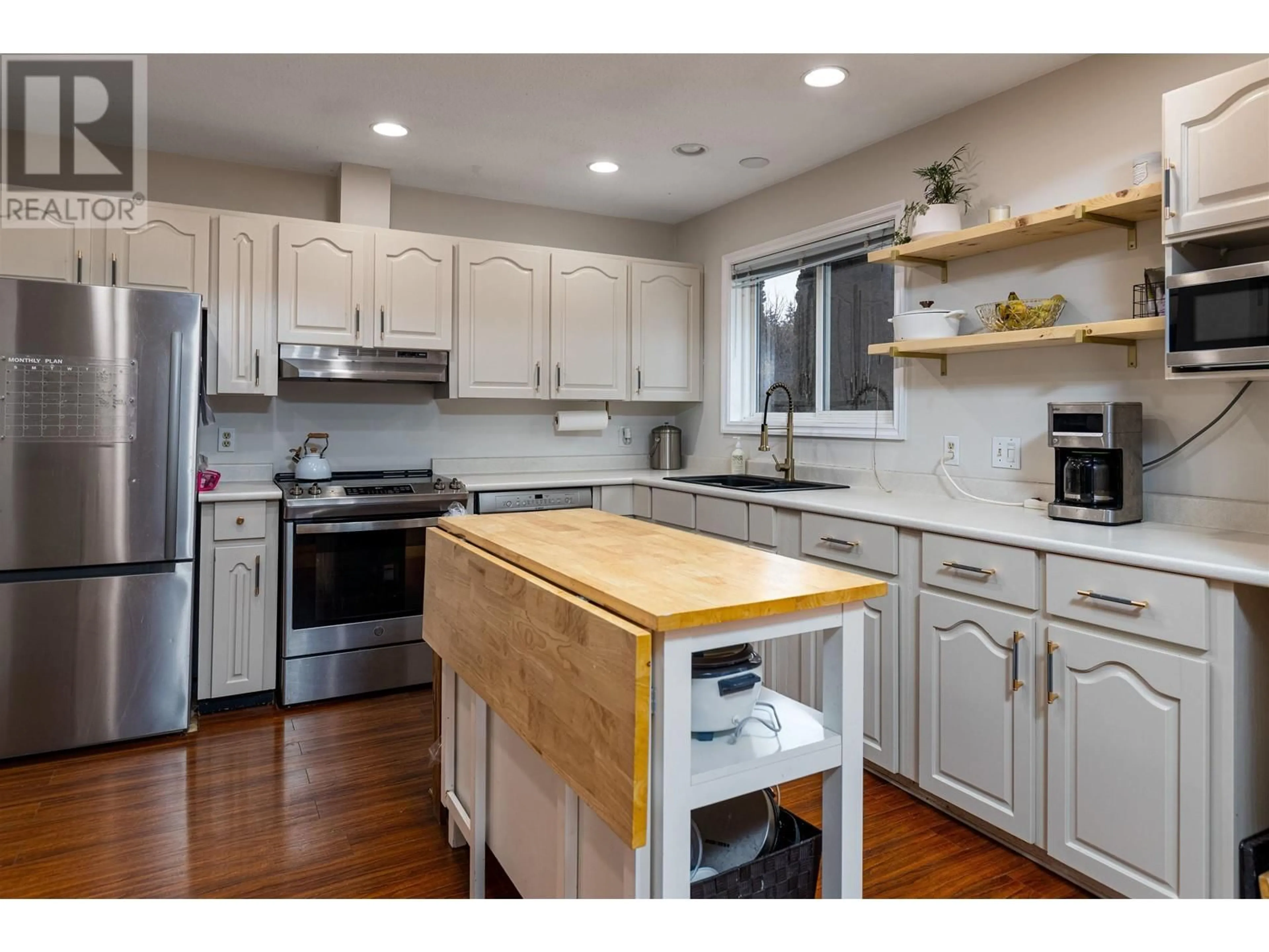 Open concept kitchen, wood/laminate floor for 3804 DEJONG CRESCENT, Terrace British Columbia V8G4W6