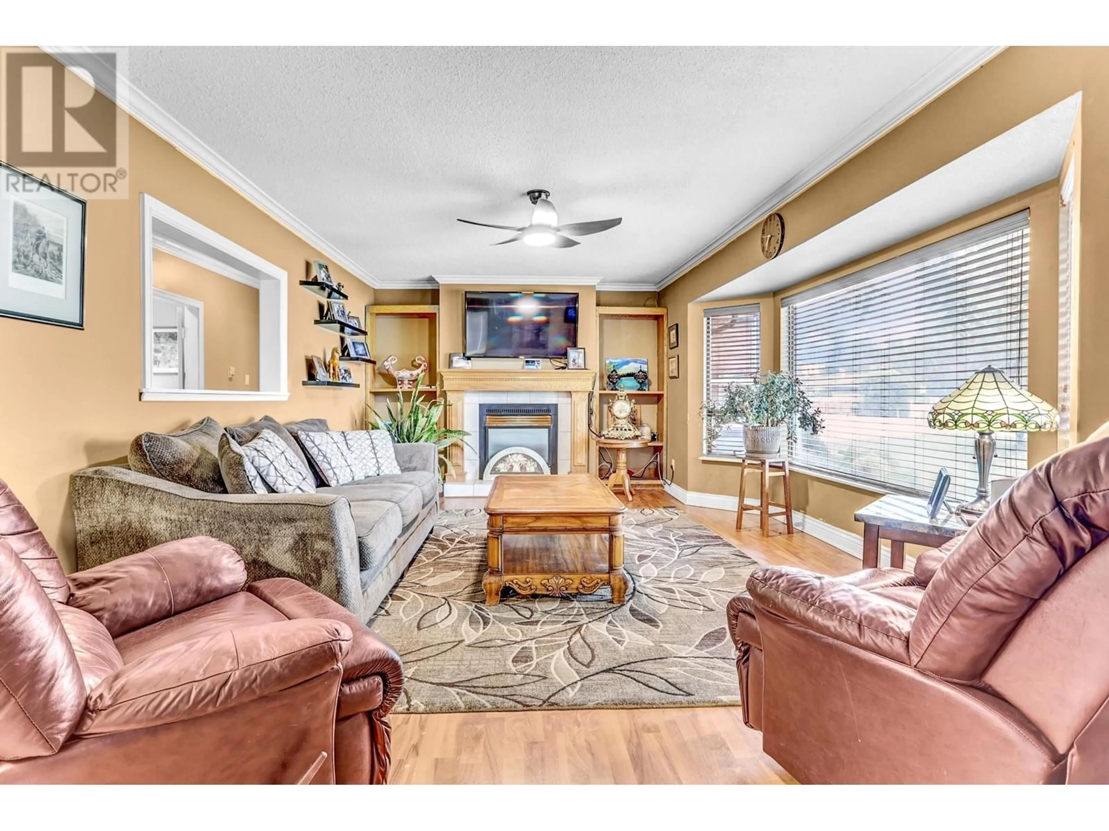 Living room with furniture, wood/laminate floor for 12451 203 STREET, Maple Ridge British Columbia V2X4W3