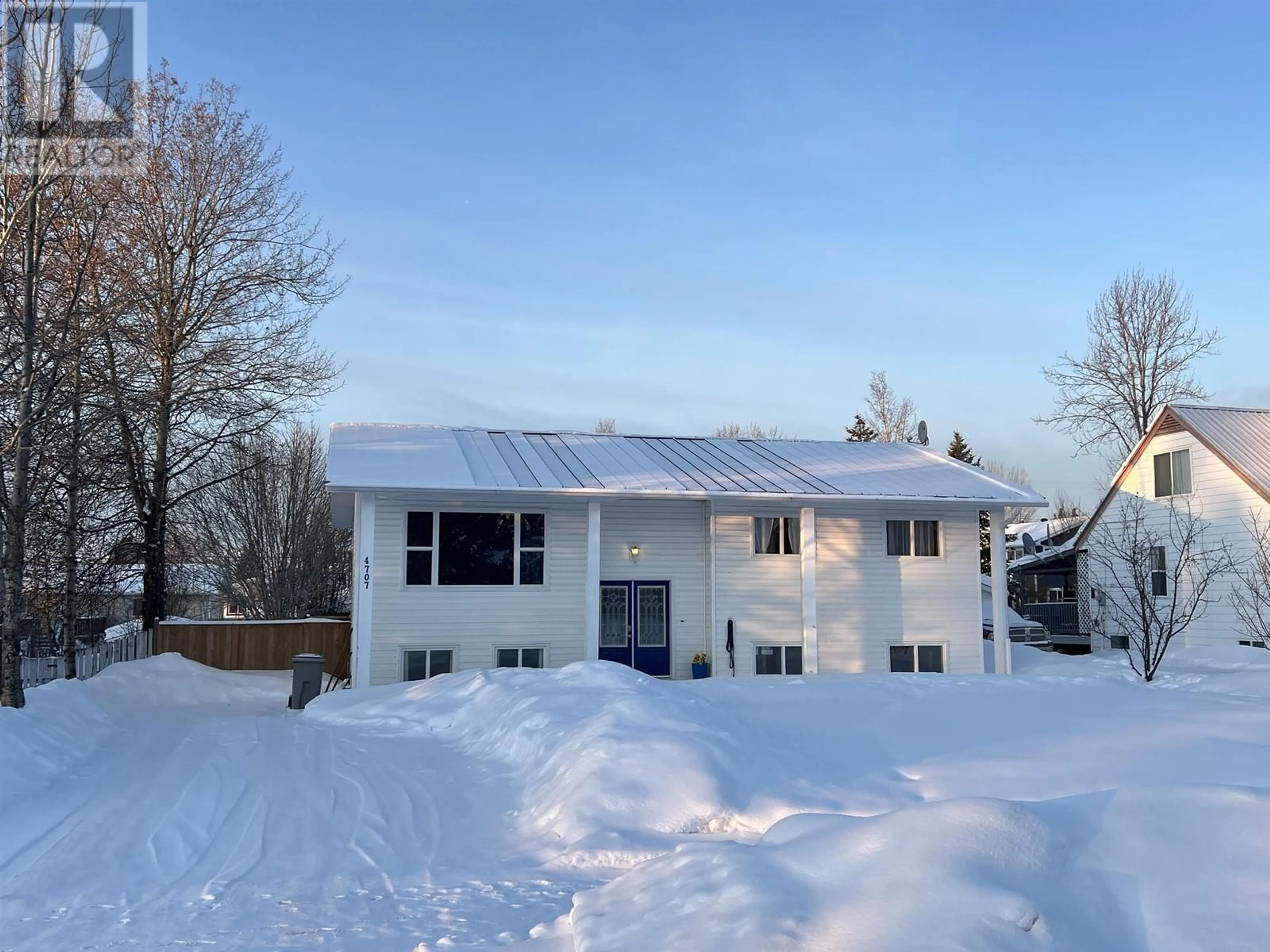 A pic from outside/outdoor area/front of a property/back of a property/a pic from drone, street for 4707 SPRUCE AVENUE, Fort Nelson British Columbia V0C1R0