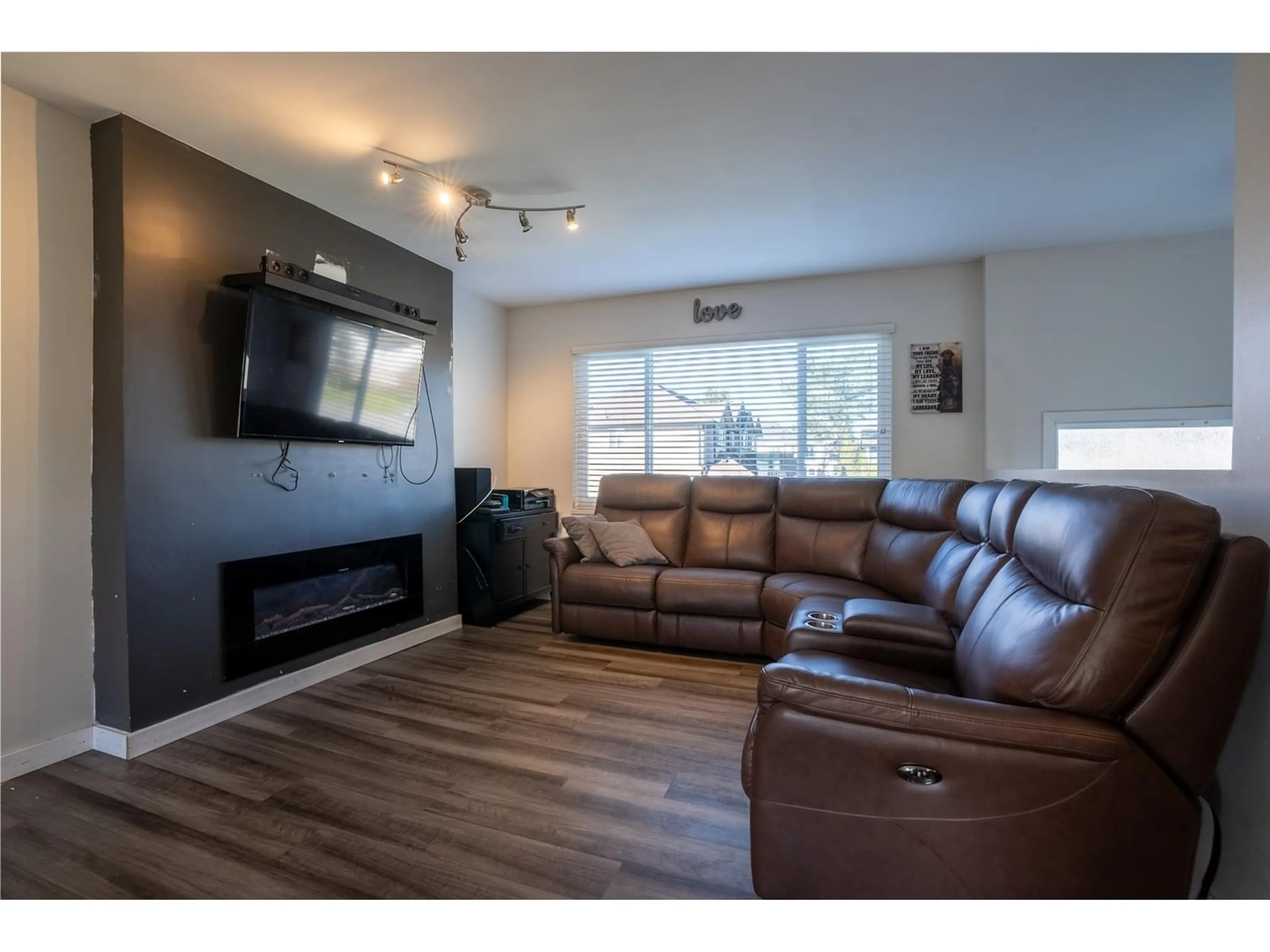 Living room with furniture, wood/laminate floor for 6266 175B STREET, Surrey British Columbia V3S5Z4