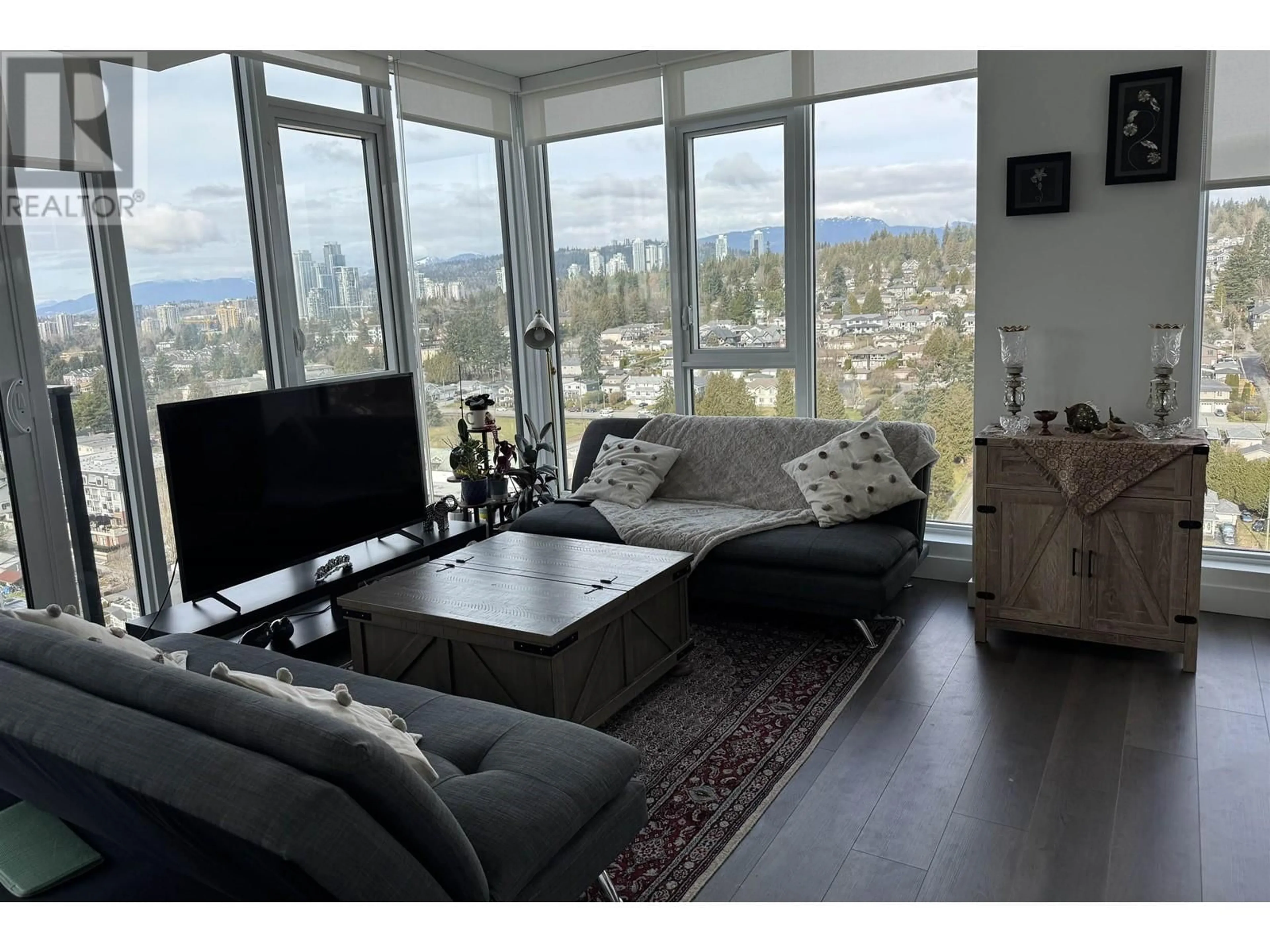 Living room with furniture, wood/laminate floor for 2303 - 901 LOUGHEED HIGHWAY, Coquitlam British Columbia V3K0J3