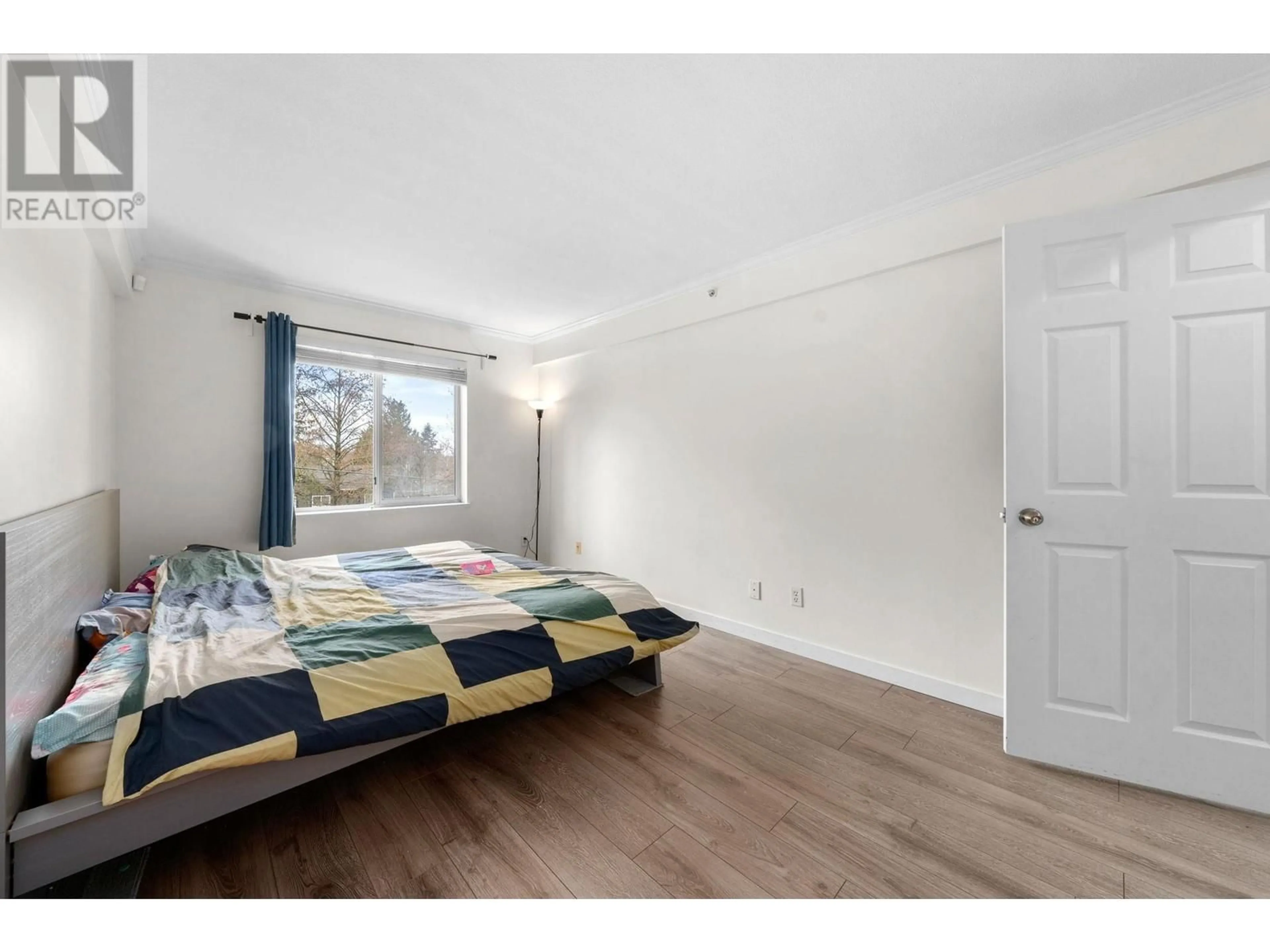 Bedroom with bed, wood/laminate floor for 306 - 3624 FRASER STREET, Vancouver British Columbia V5V4C8