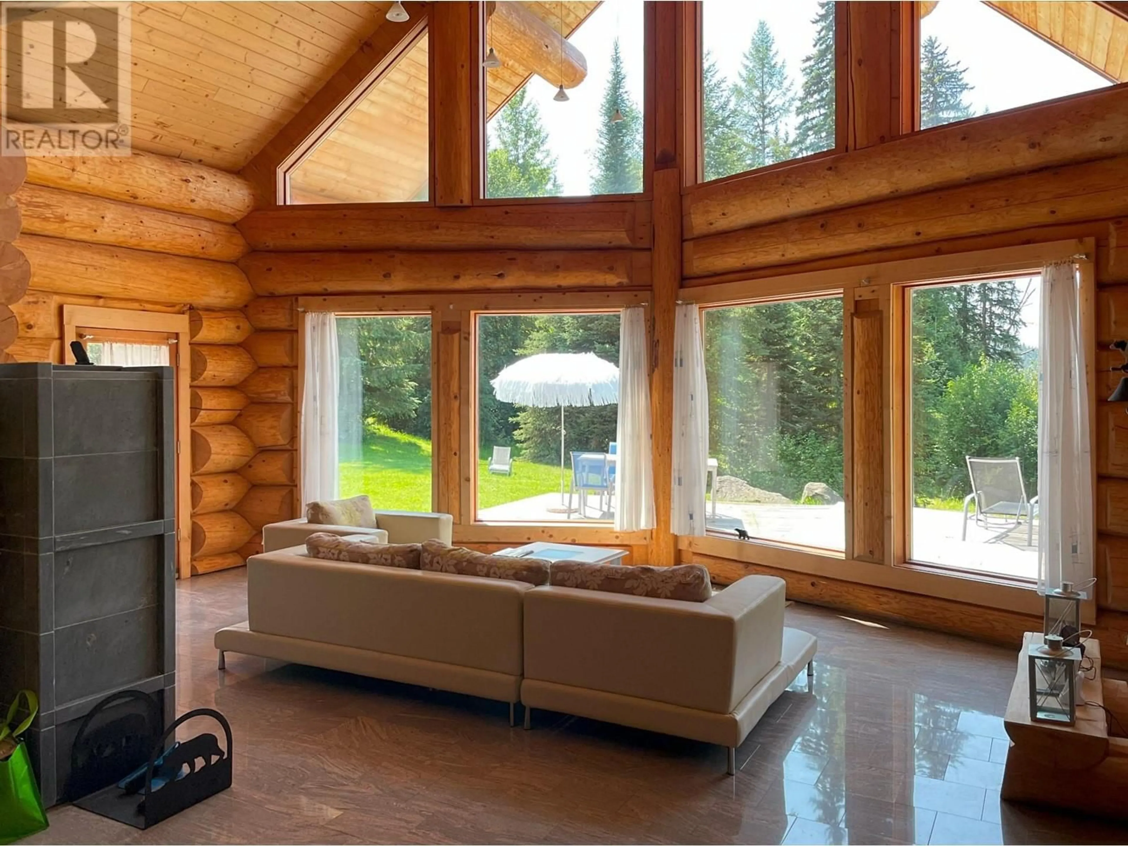 Living room with furniture, wood/laminate floor for 6326 LEAMONT PLACE, Horsefly British Columbia V0L1L0