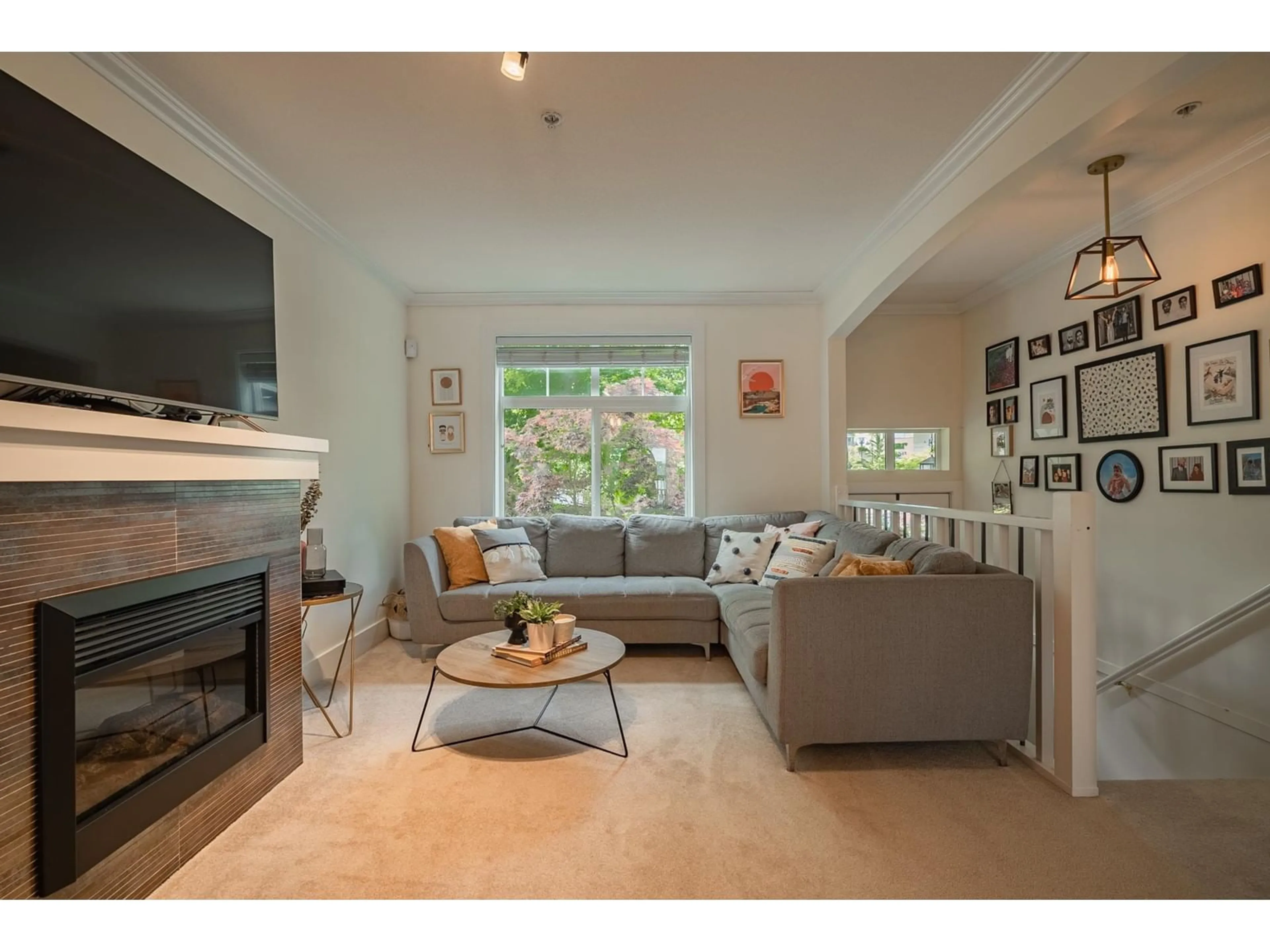 Living room with furniture, wood/laminate floor for 15 - 15833 26, Surrey British Columbia V3Z2X5