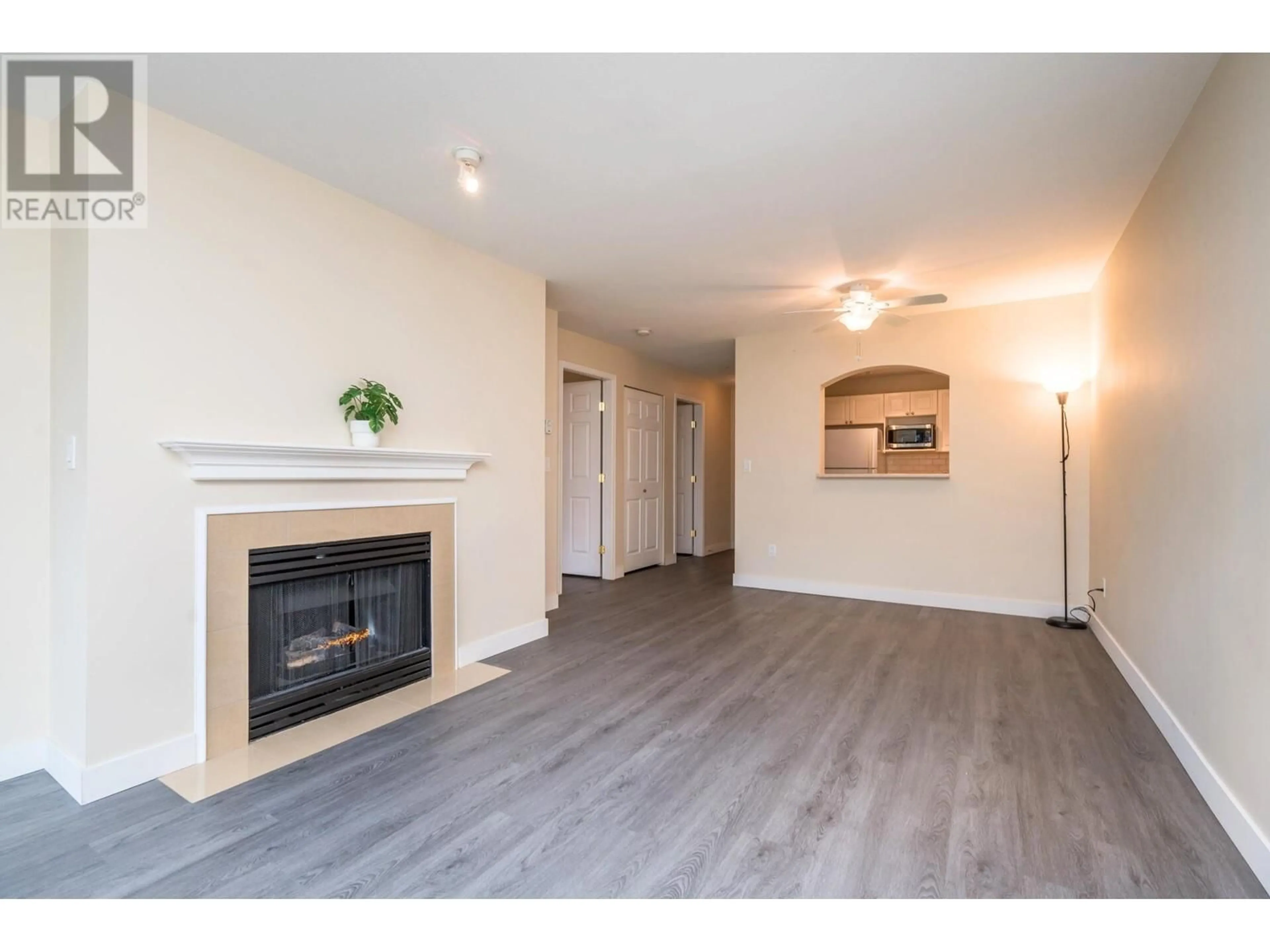 Living room with furniture, wood/laminate floor for 220 2980 PRINCESS CRESCENT, Coquitlam British Columbia V3B7R4