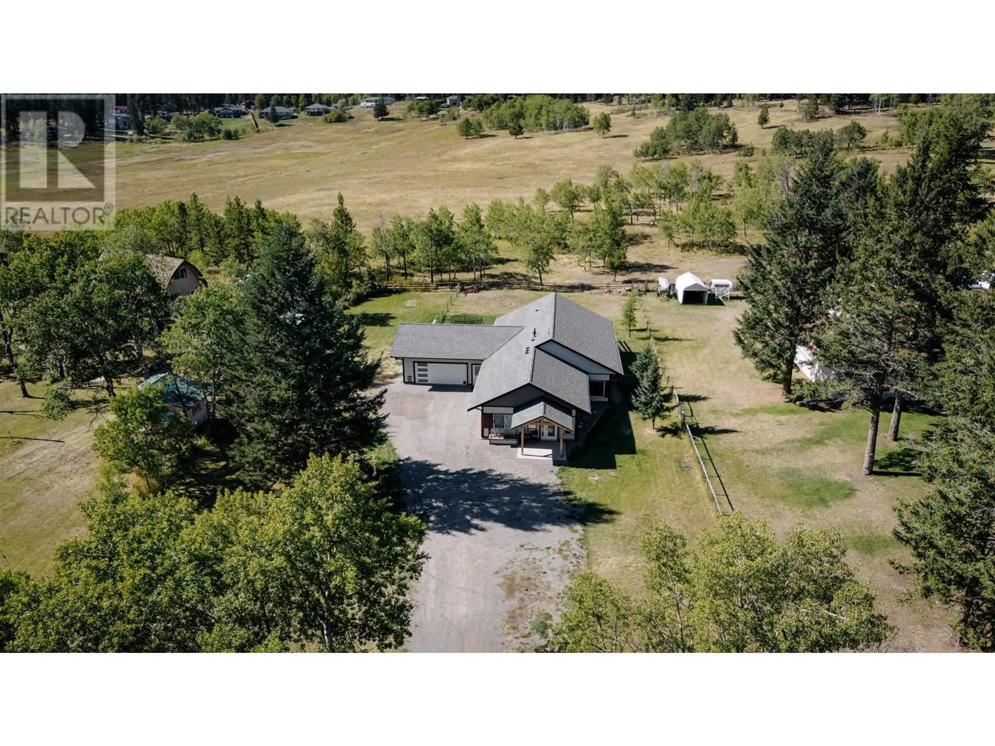 A pic from outside/outdoor area/front of a property/back of a property/a pic from drone, mountain view for 5070 KINNCUM PLACE, 108 Mile Ranch British Columbia V0K2Z0