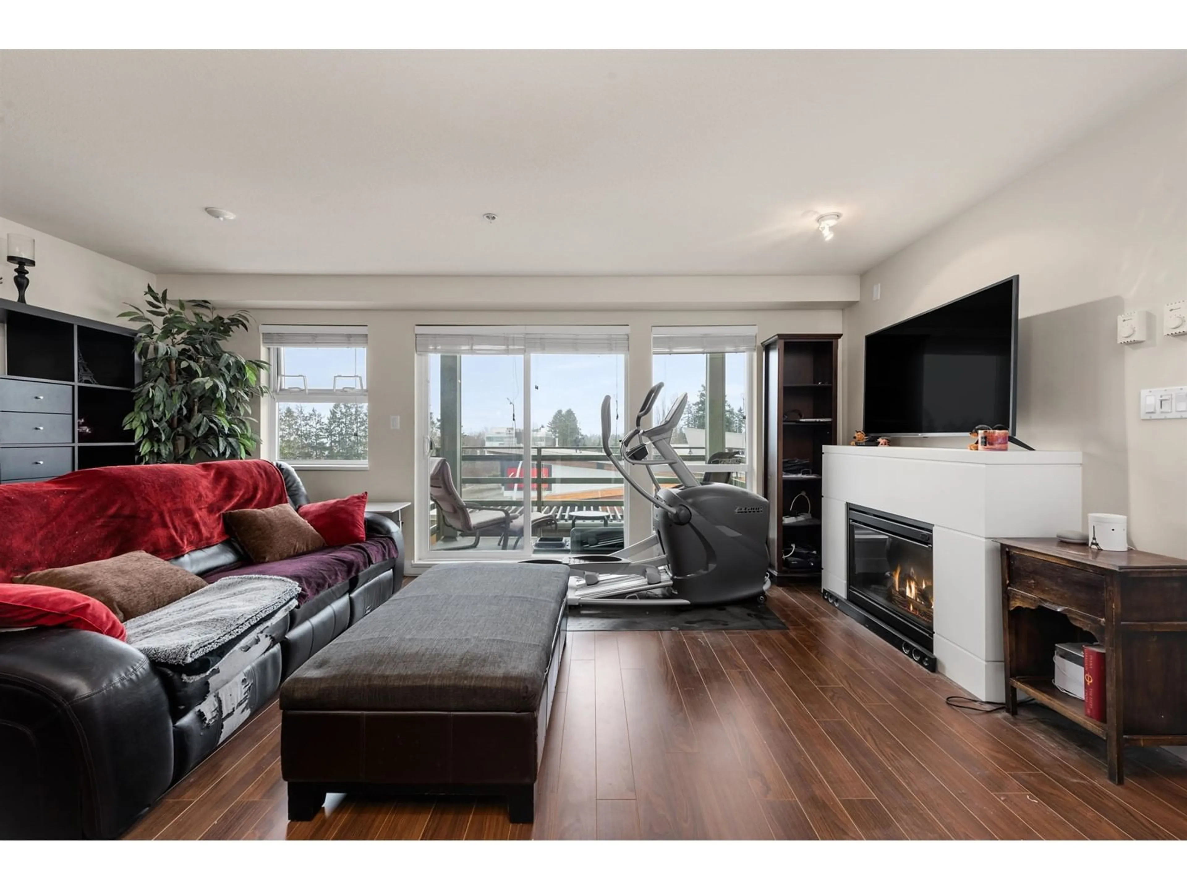 Living room with furniture, wood/laminate floor for 307 15795 CROYDON DRIVE, Surrey British Columbia V3Z2L6