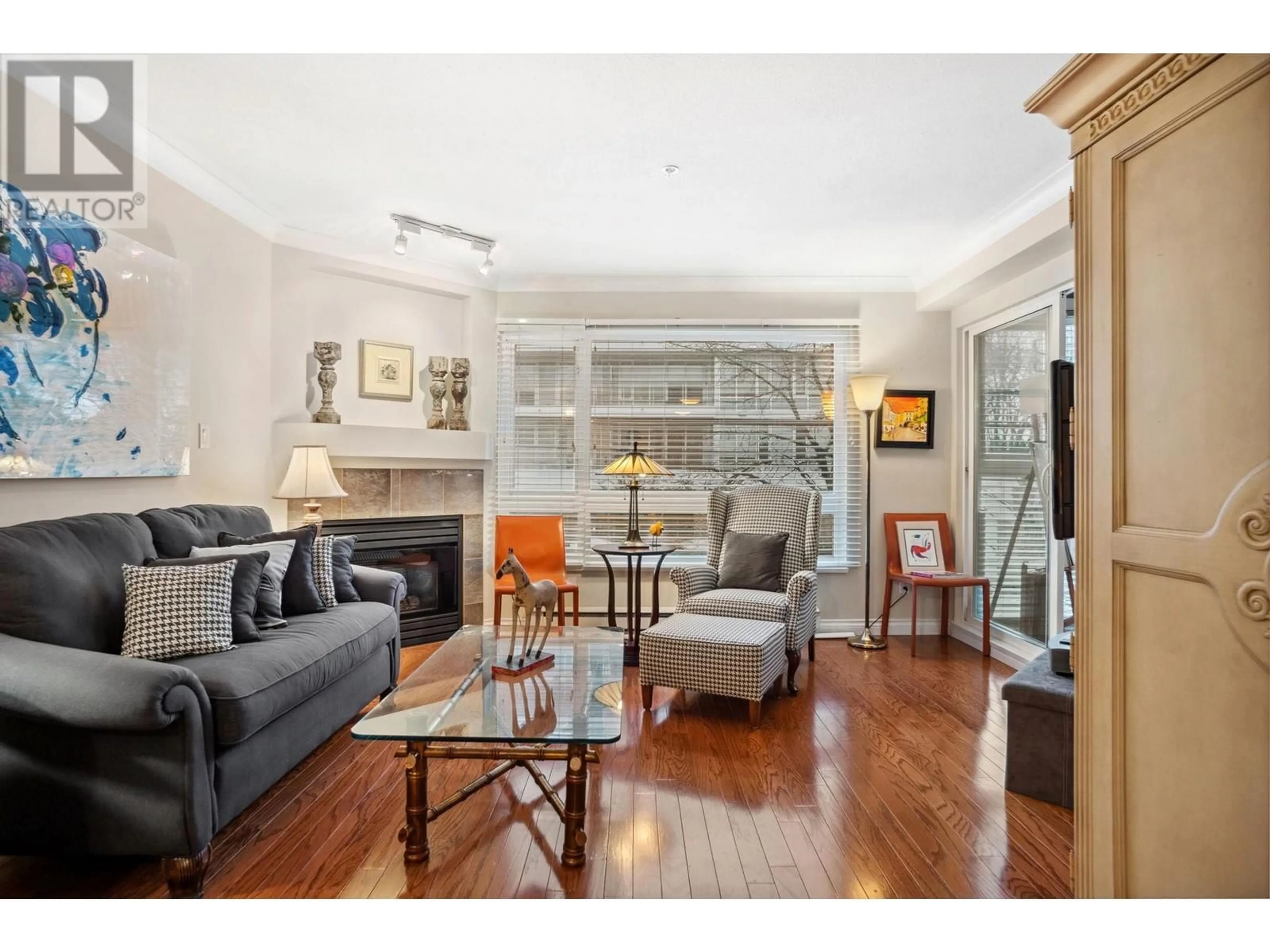 Living room with furniture, wood/laminate floor for 206 3590 W 26TH AVENUE, Vancouver British Columbia V6S1N9