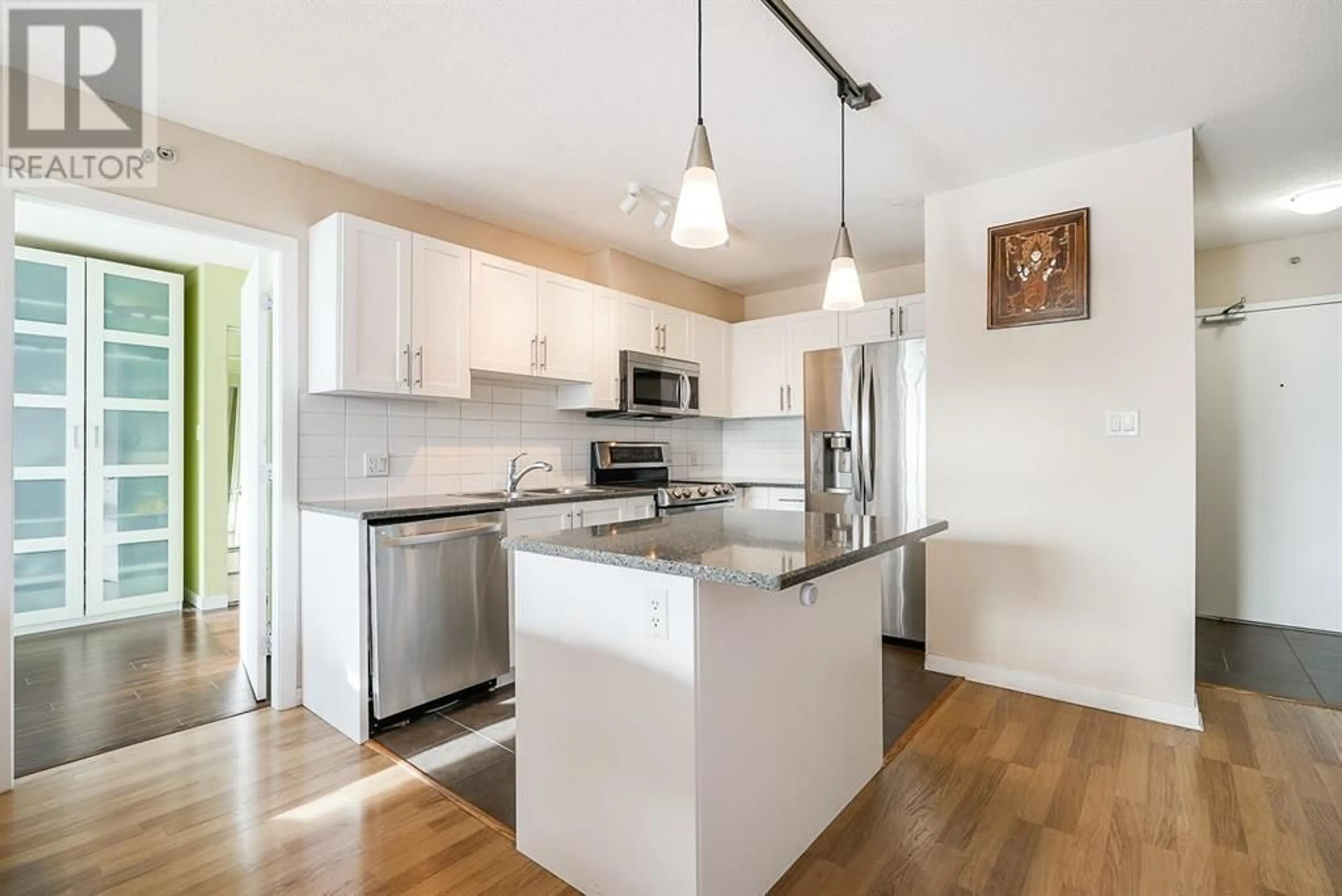 Open concept kitchen, wood/laminate floor for 3208 - 1178 HEFFLEY CRESCENT, Coquitlam British Columbia V3B0A7