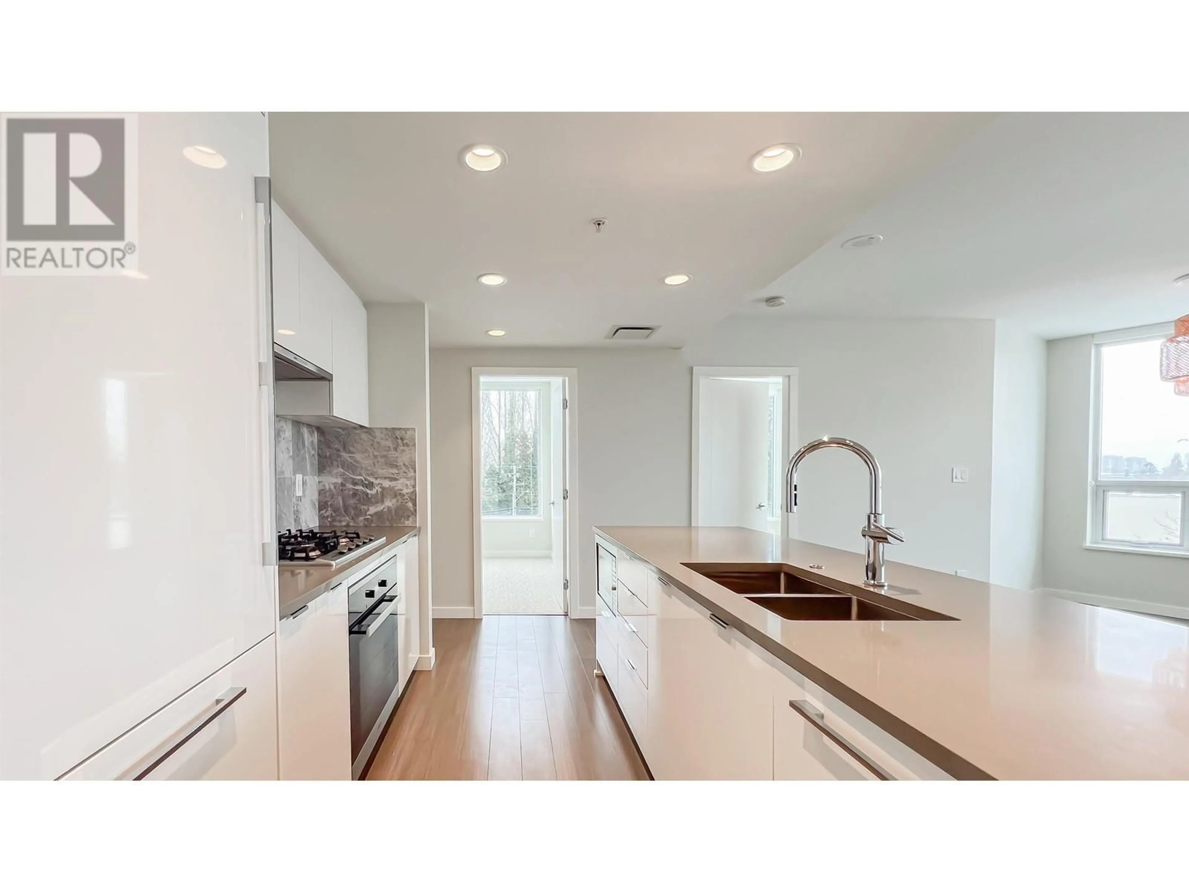 Open concept kitchen, unknown for 416 3699 SEXSMITH ROAD, Richmond British Columbia V6X0W4