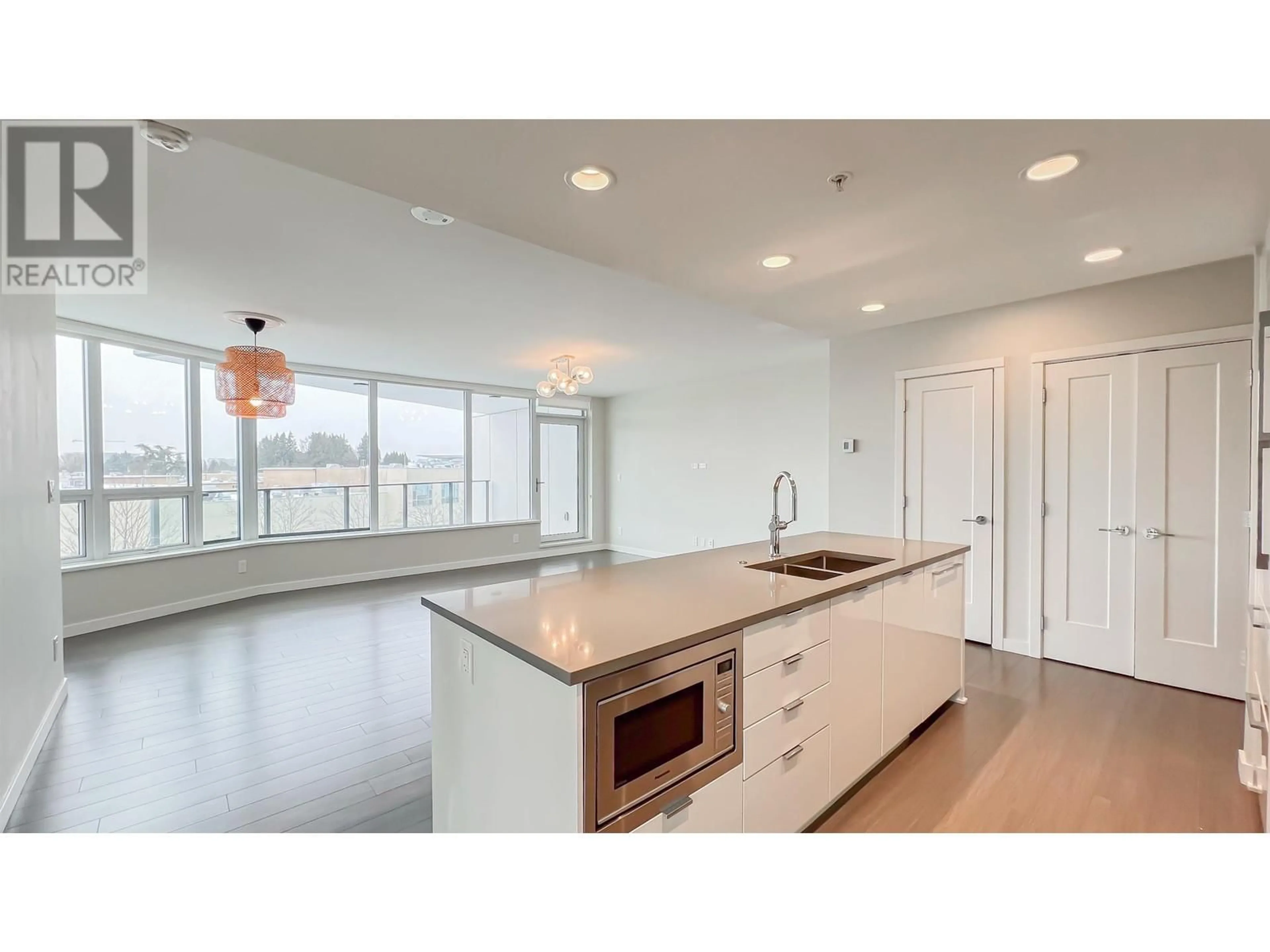 Open concept kitchen, unknown for 416 3699 SEXSMITH ROAD, Richmond British Columbia V6X0W4