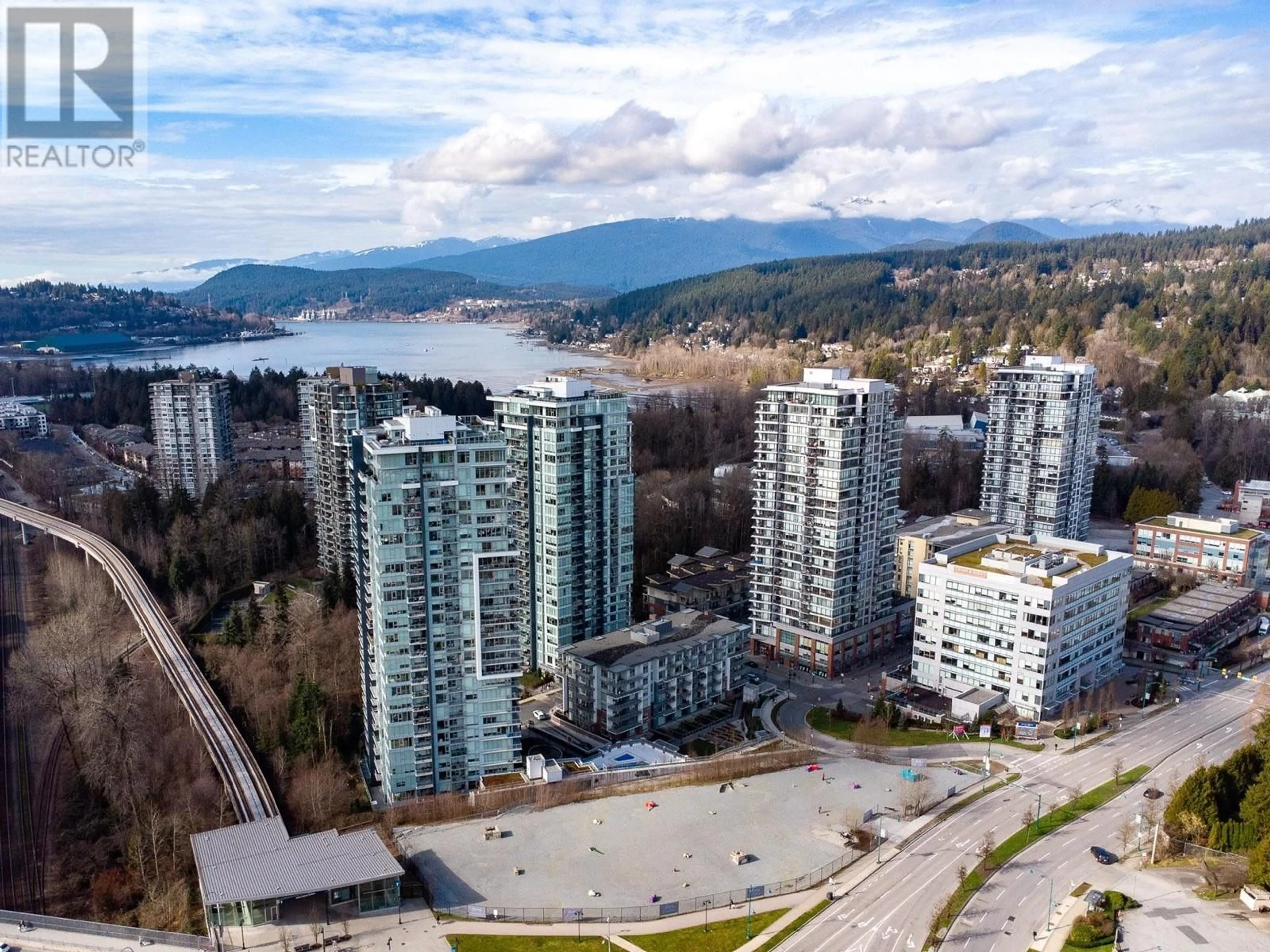 A pic from outside/outdoor area/front of a property/back of a property/a pic from drone, water/lake/river/ocean view for 1809 305 MORRISSEY ROAD, Port Moody British Columbia V3H0M3