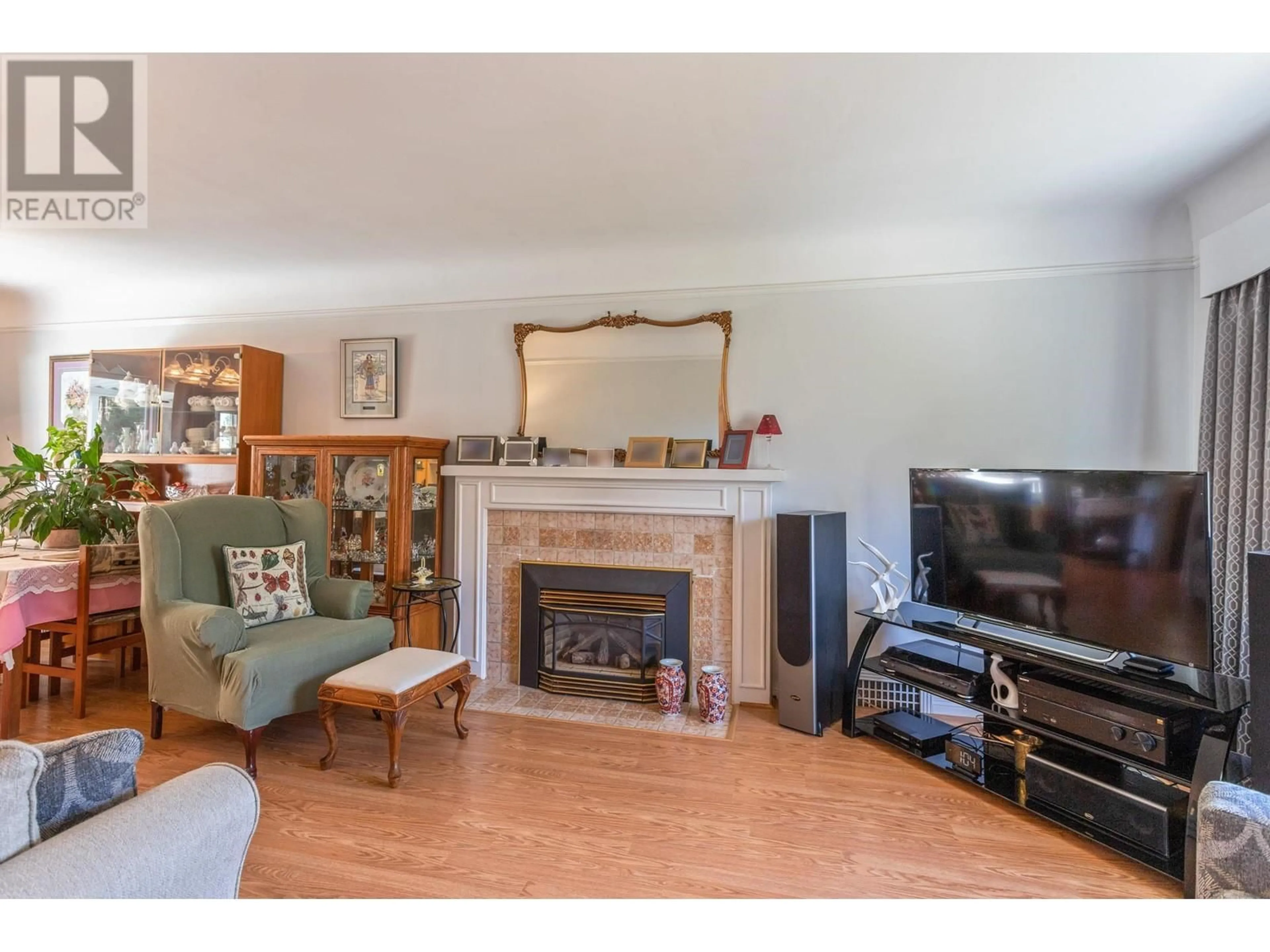 Living room with furniture, wood/laminate floor for 8222 JOFFRE AVENUE, Burnaby British Columbia V5J3L3