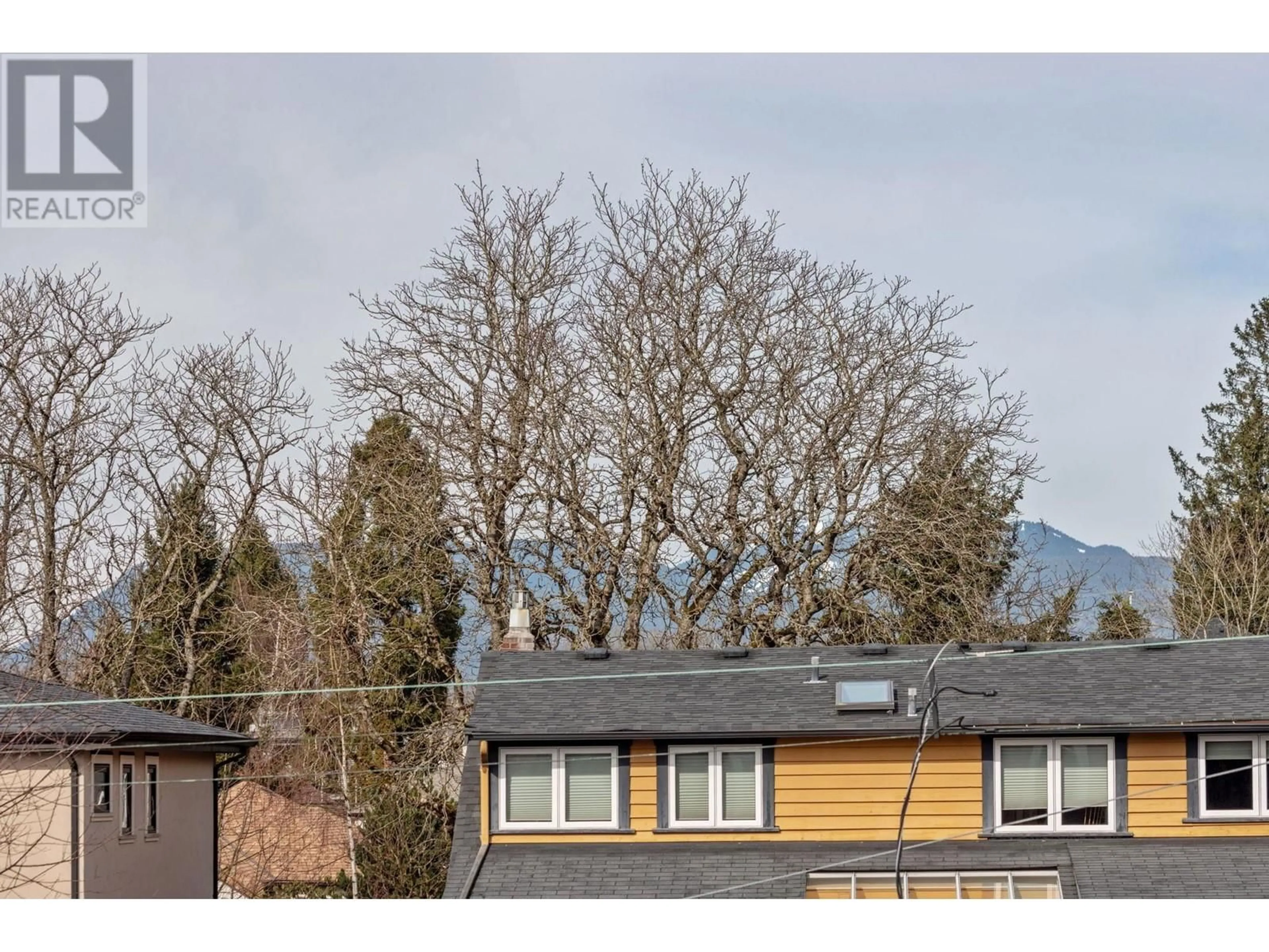 A pic from outside/outdoor area/front of a property/back of a property/a pic from drone, mountain view for 3963 W 23RD AVENUE, Vancouver British Columbia V6S1L1