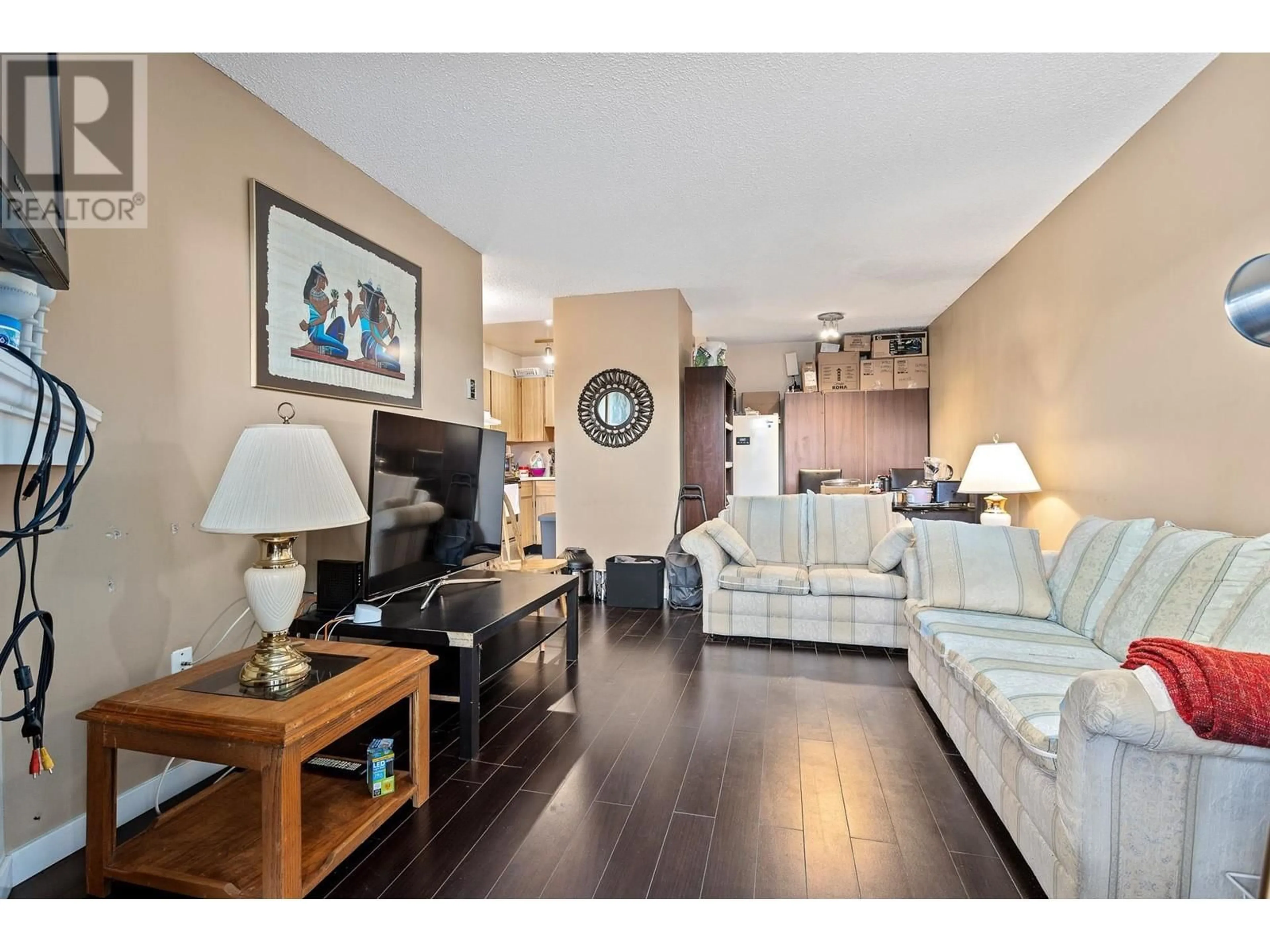 Living room with furniture, wood/laminate floor for 212 615 NORTH ROAD, Coquitlam British Columbia V3J1P1