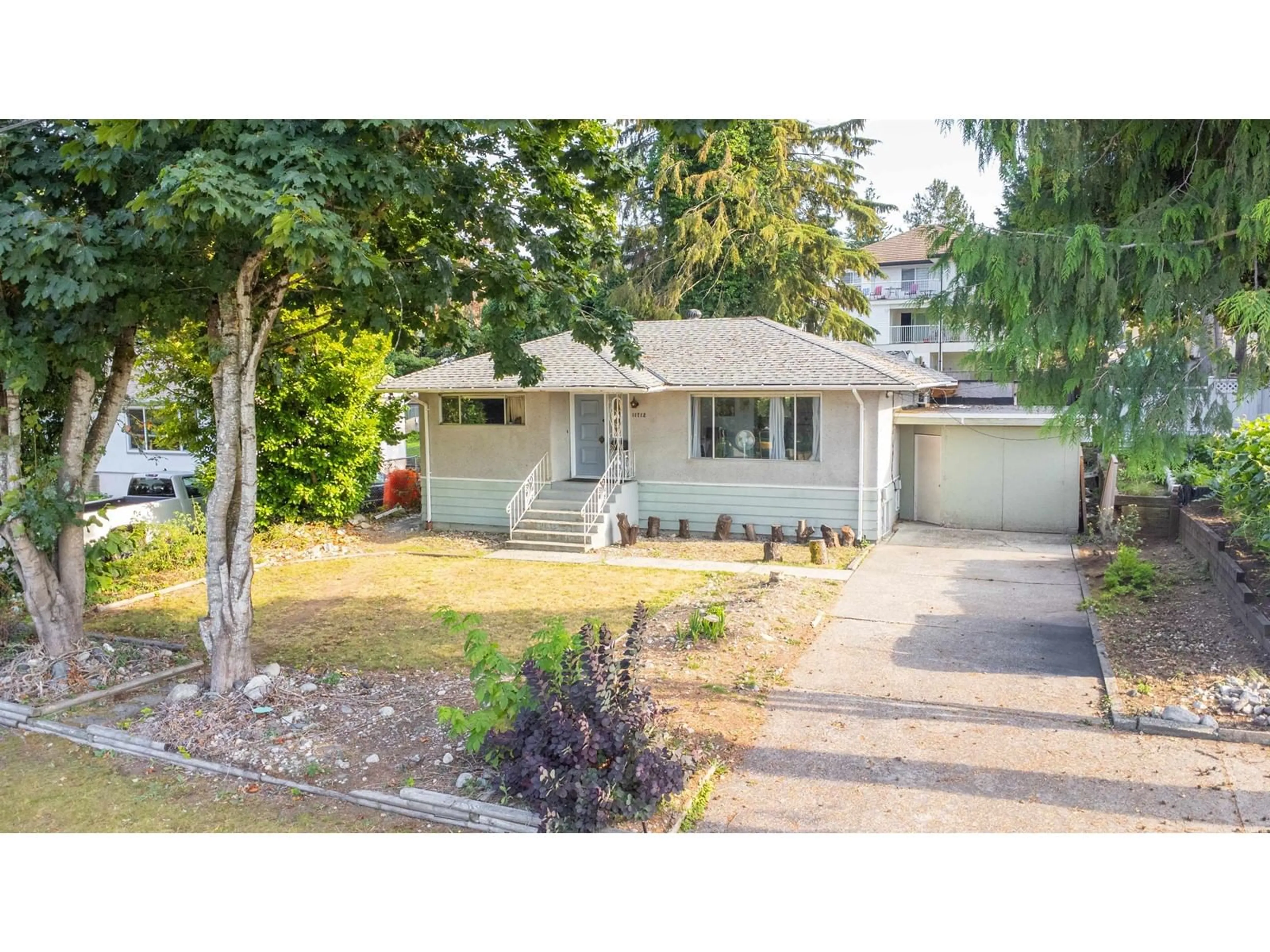 A pic from outside/outdoor area/front of a property/back of a property/a pic from drone, street for 11712 97, Surrey British Columbia V3V2B8