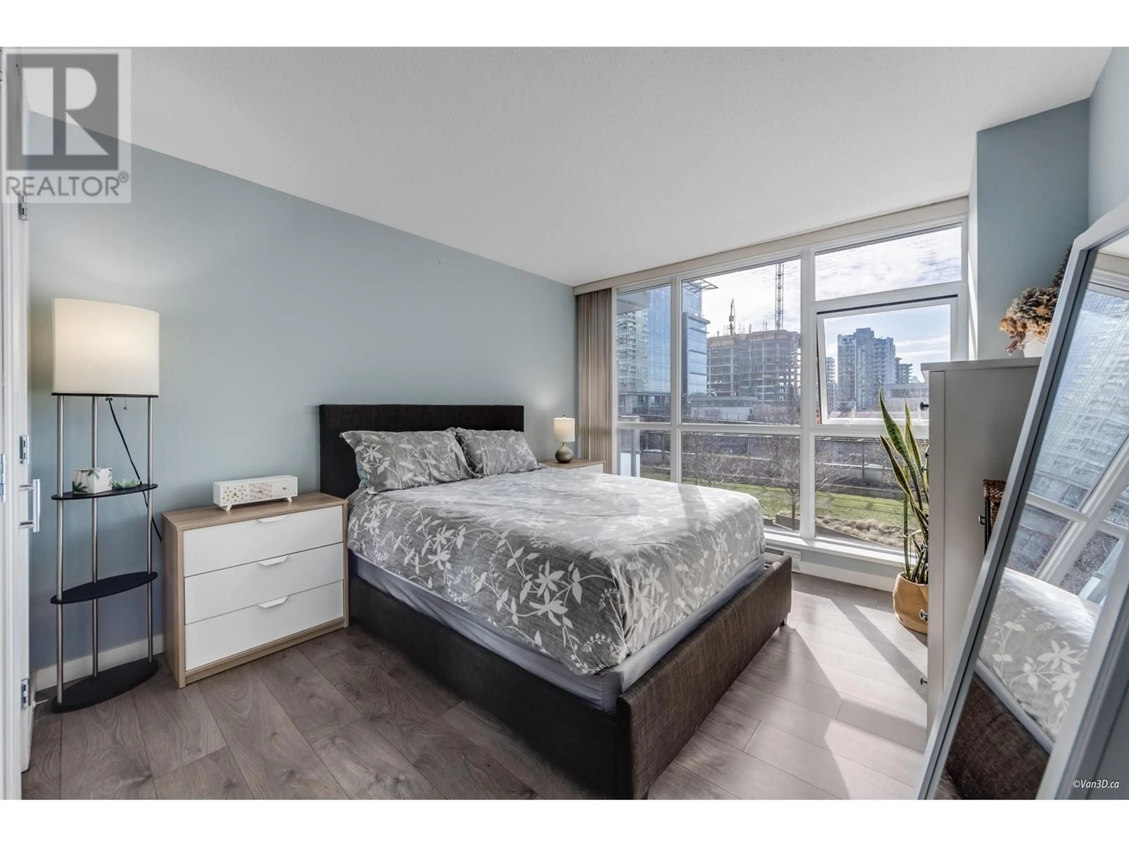 Bedroom with bed, wood/laminate floor for 405 - 4400 BUCHANAN STREET, Burnaby British Columbia V5C0E3