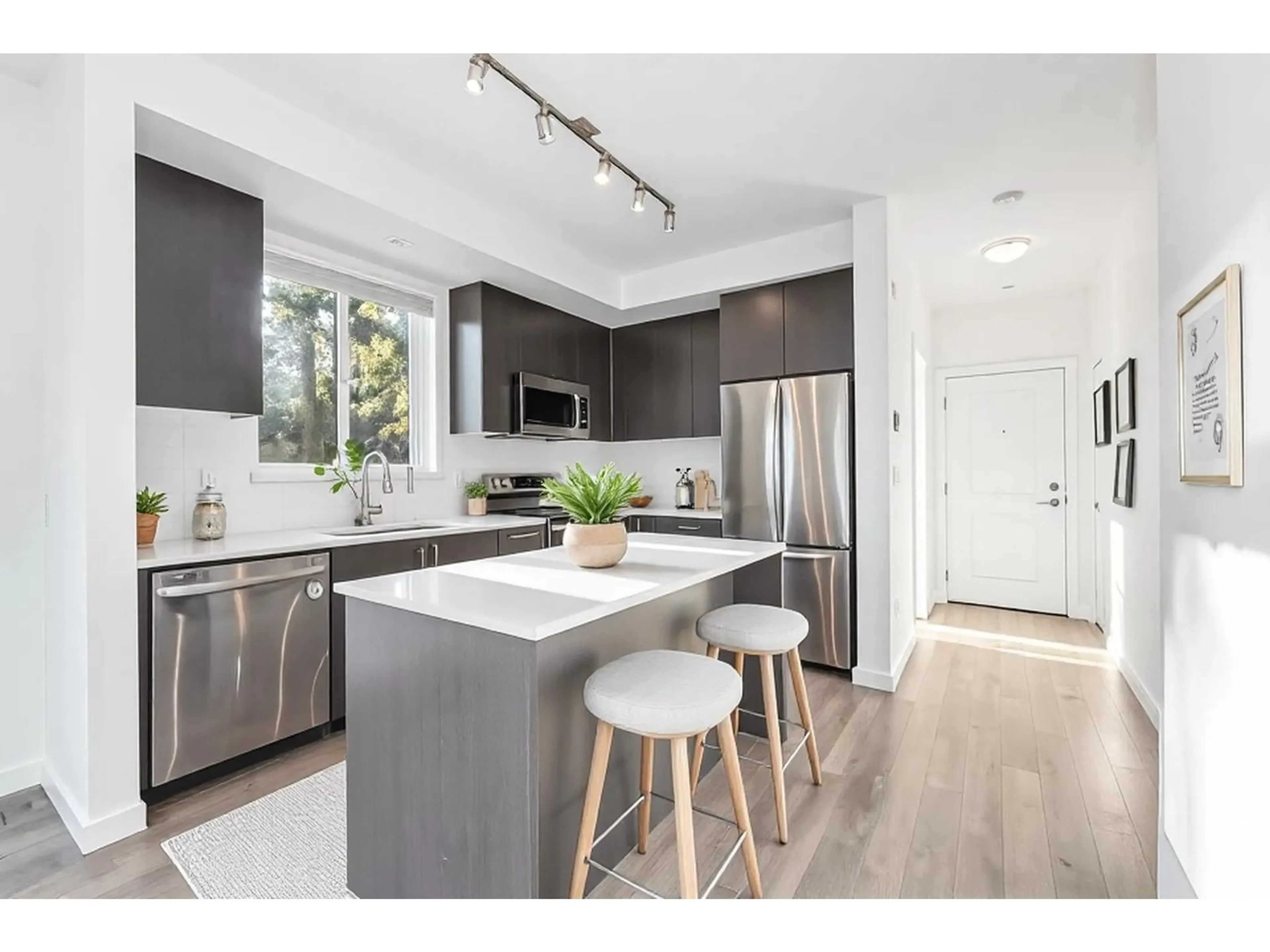 Open concept kitchen, wood/laminate floor for 108 - 15858 FRASER, Surrey British Columbia V4N6X4