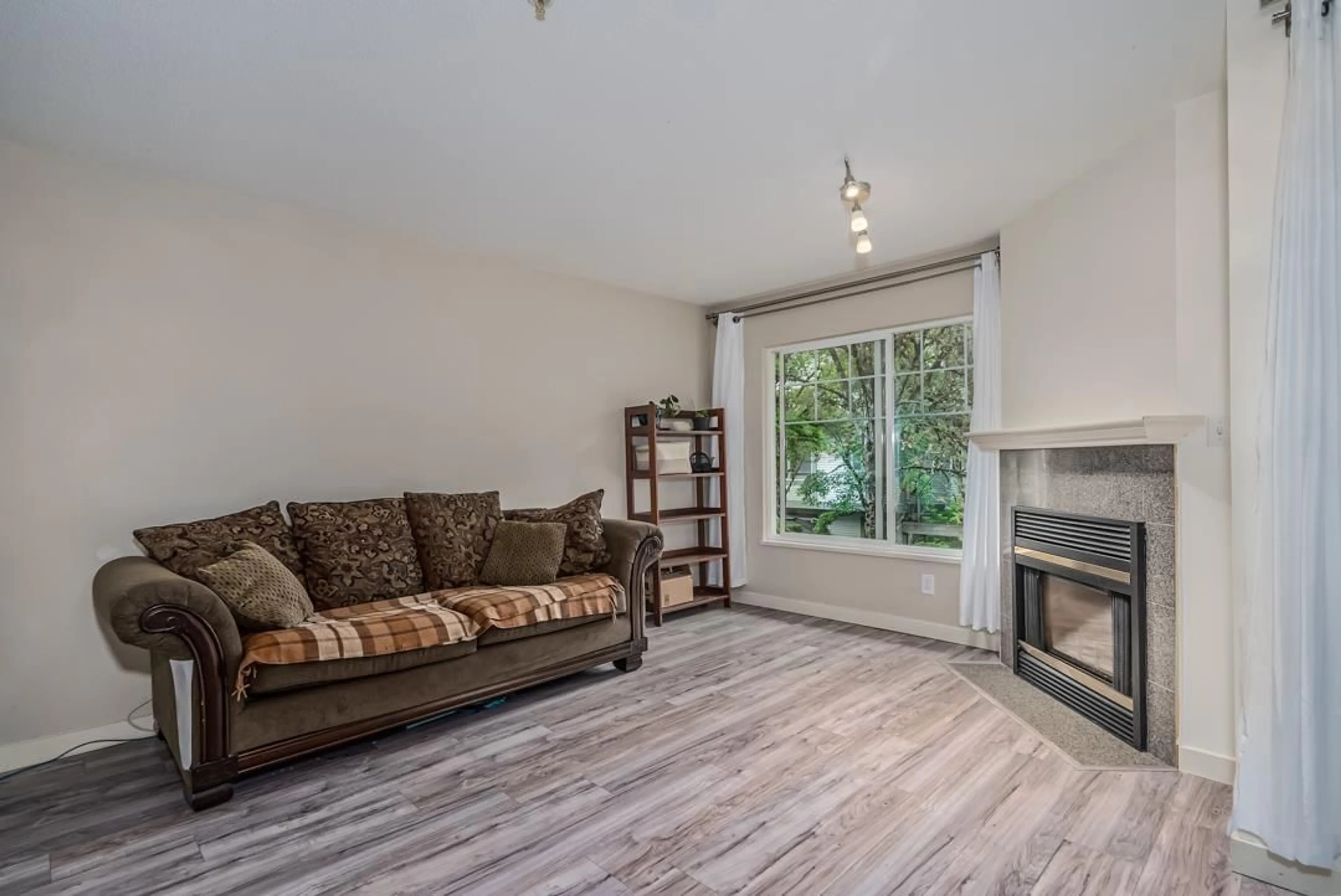 Living room with furniture, wood/laminate floor for 48 8892 208TH STREET, Langley British Columbia V1M2N8