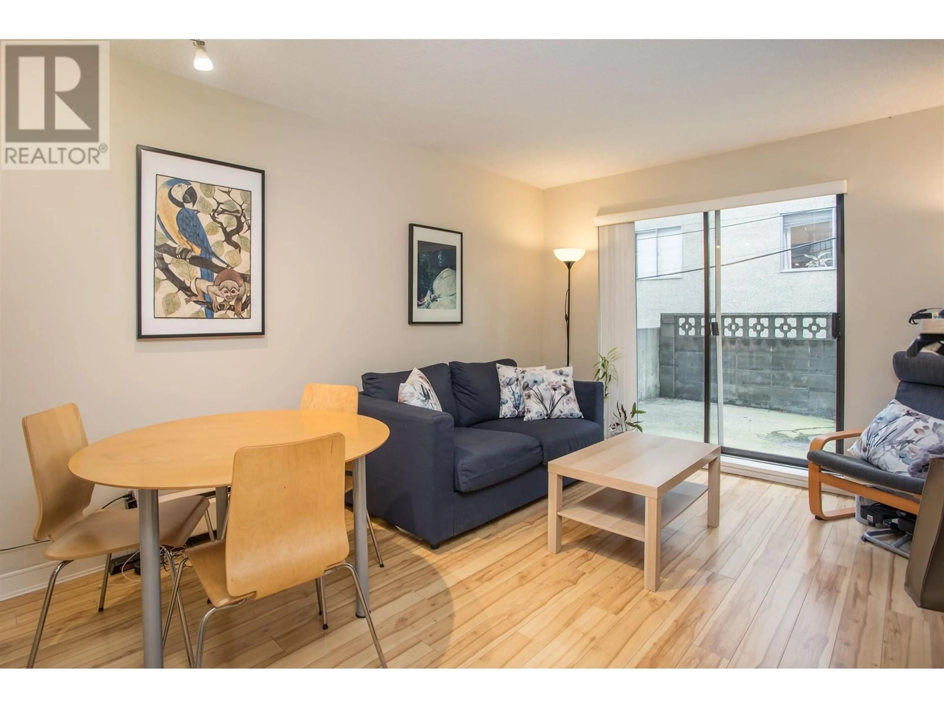 Living room with furniture, wood/laminate floor for 106 - 2330 MAPLE STREET, Vancouver British Columbia V6J3T6