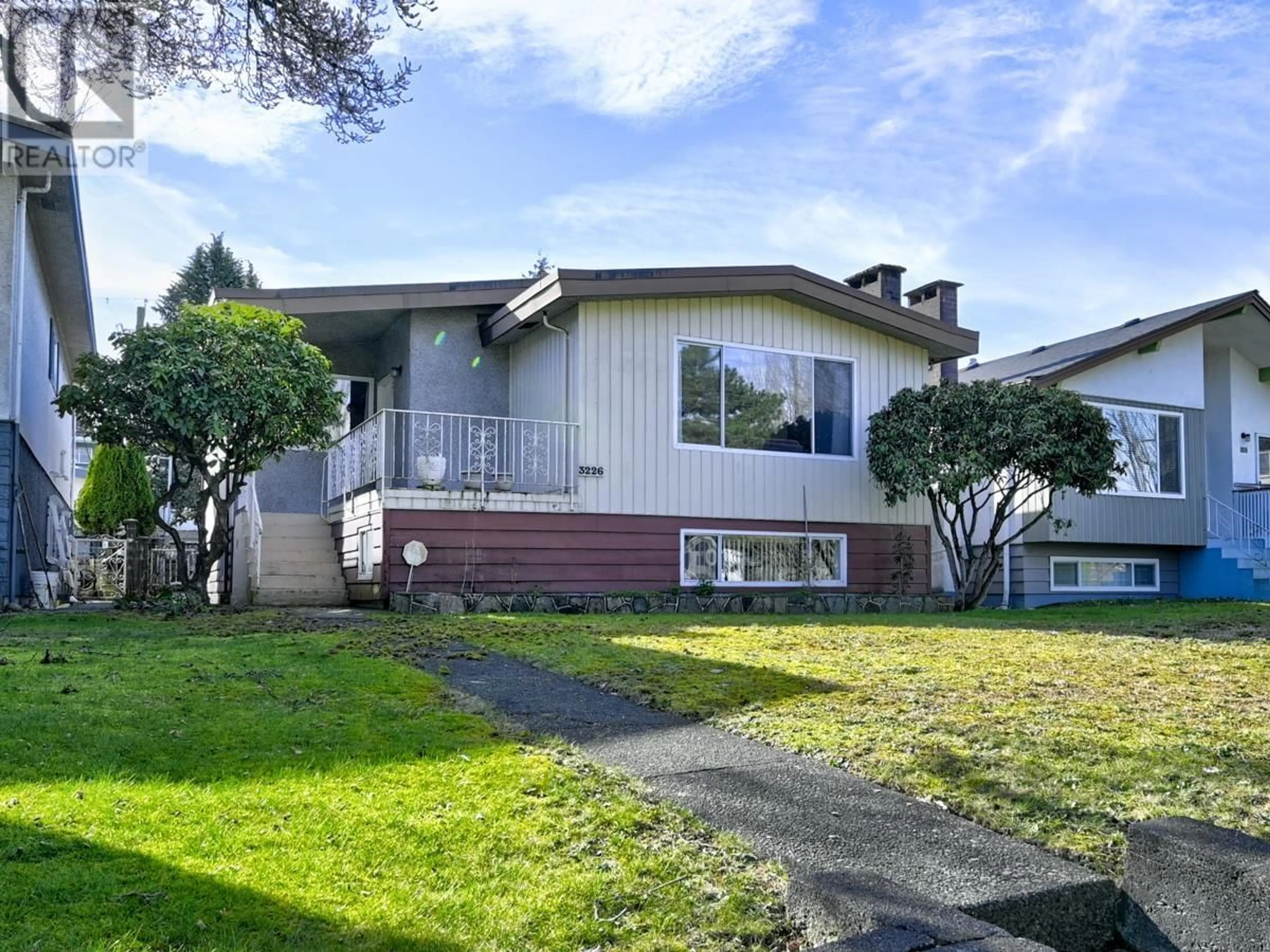 Home with vinyl exterior material, street for 3226 E 1ST AVENUE, Vancouver British Columbia V5M1B8