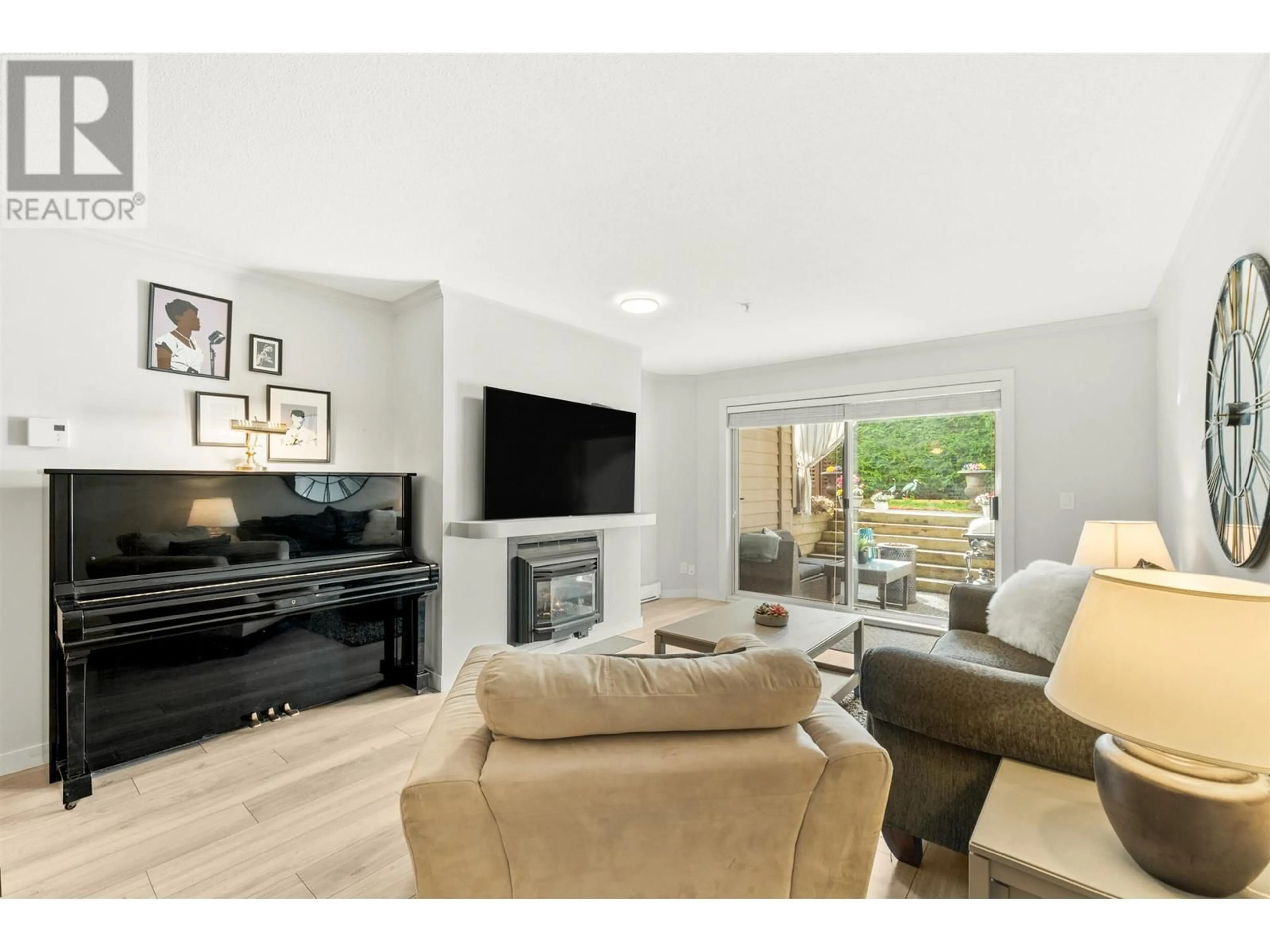 Living room with furniture, wood/laminate floor for 305 1050 BOWRON COURT, North Vancouver British Columbia V7H2X6