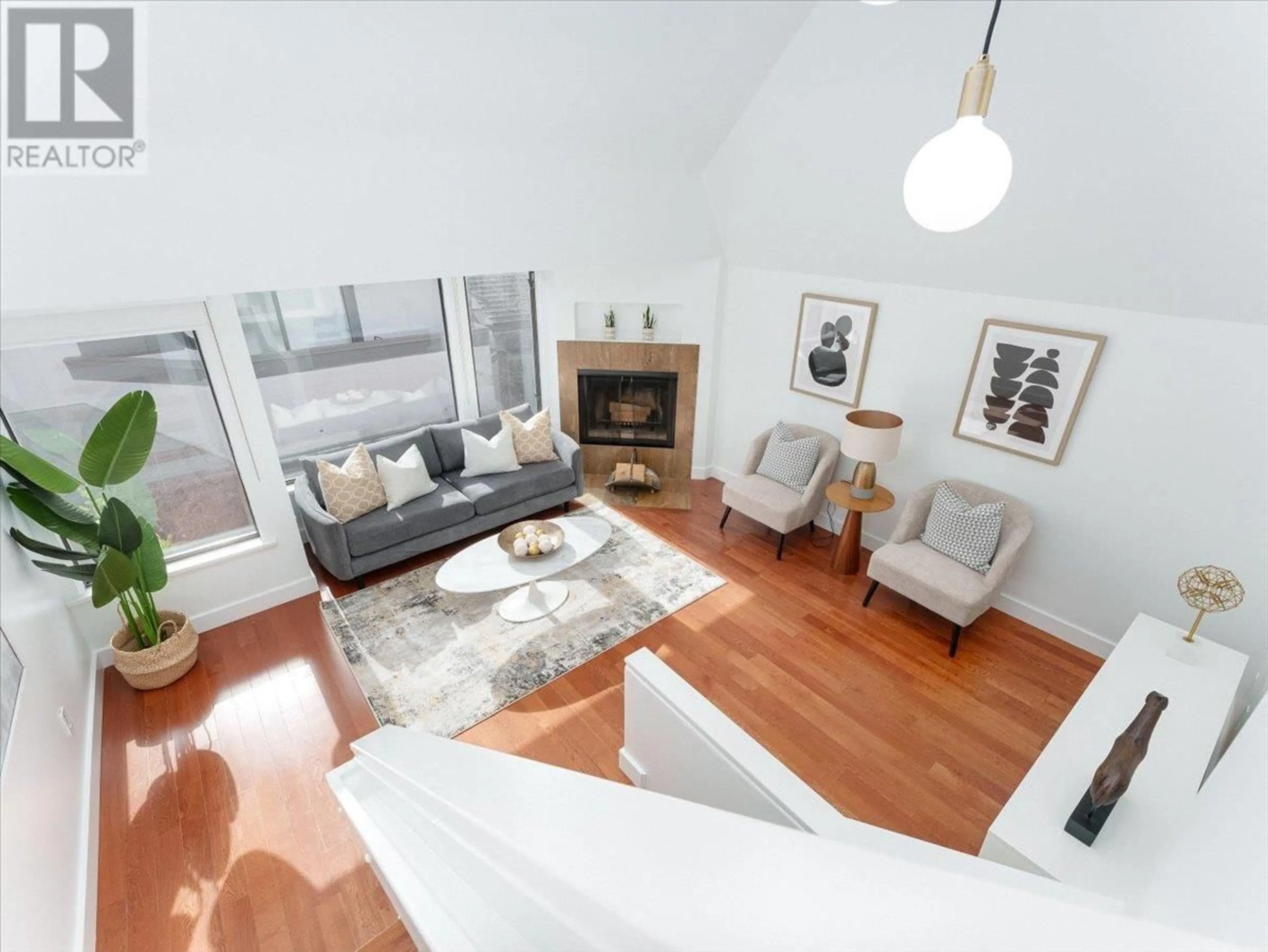 Living room with furniture, wood/laminate floor for 1732 CYPRESS STREET, Vancouver British Columbia V6J4W2