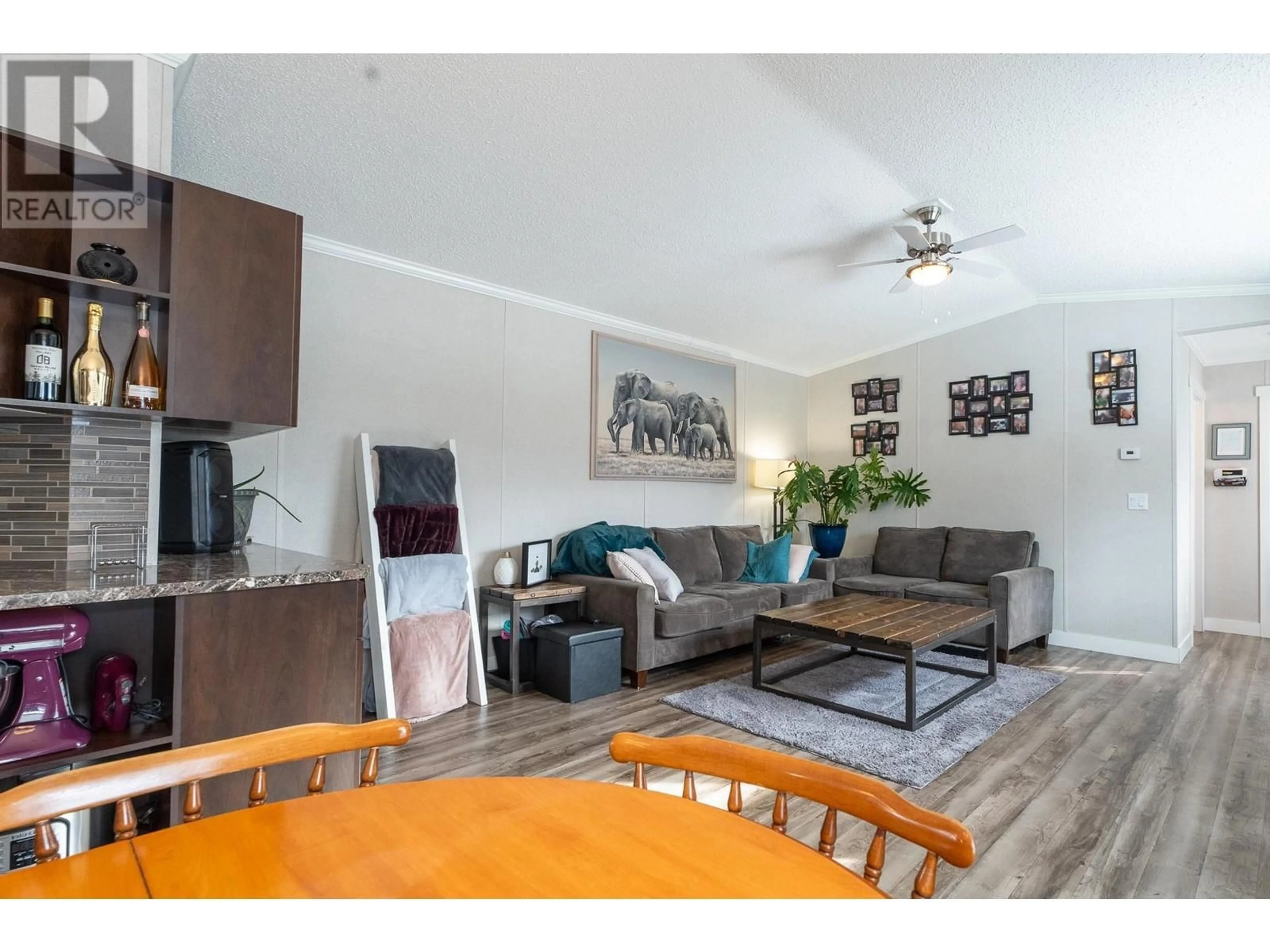 Living room with furniture, wood/laminate floor for D1A 5931 COOK COURT, Prince George British Columbia V2K3A3