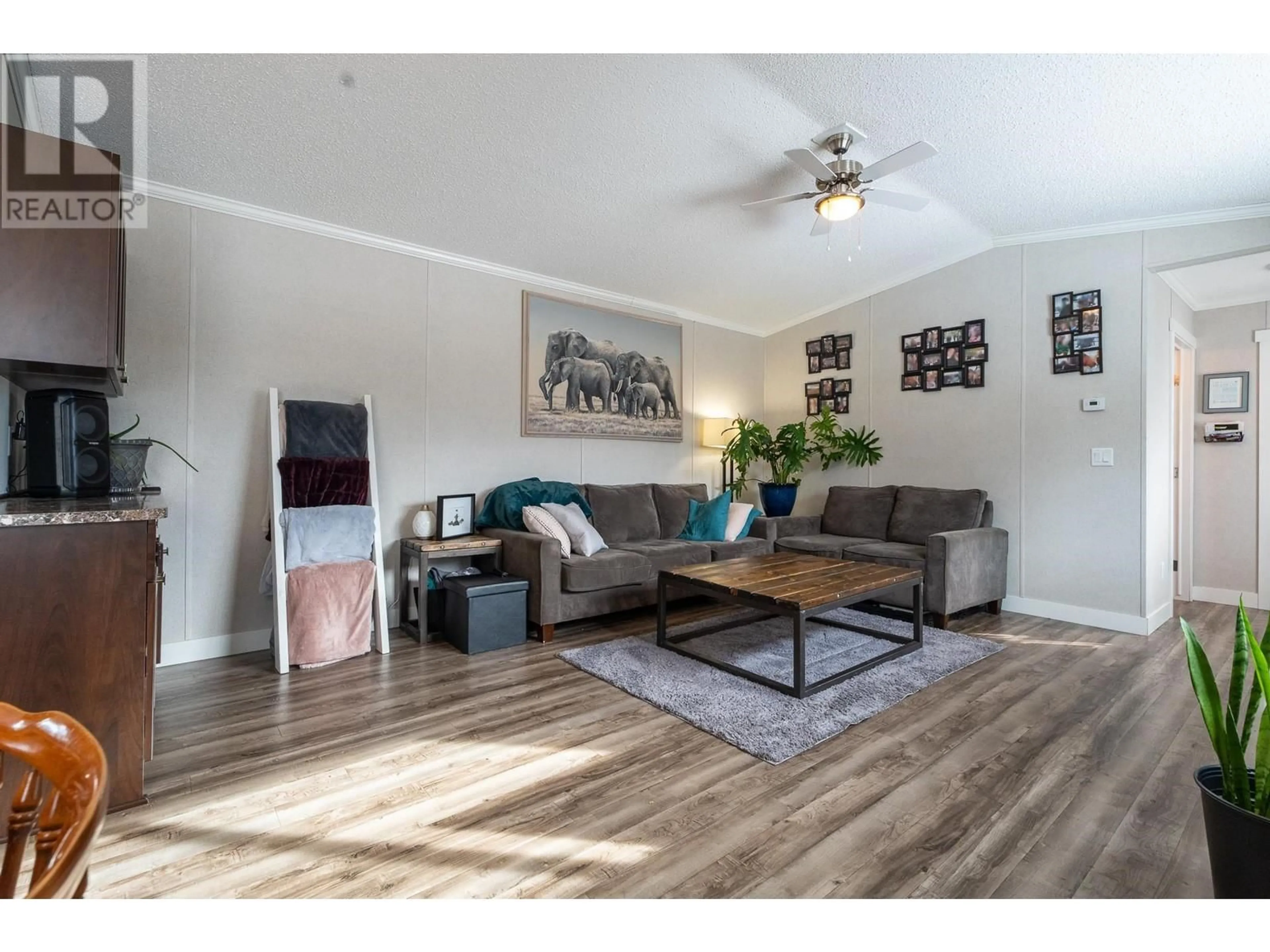 Living room with furniture, wood/laminate floor for D1A 5931 COOK COURT, Prince George British Columbia V2K3A3