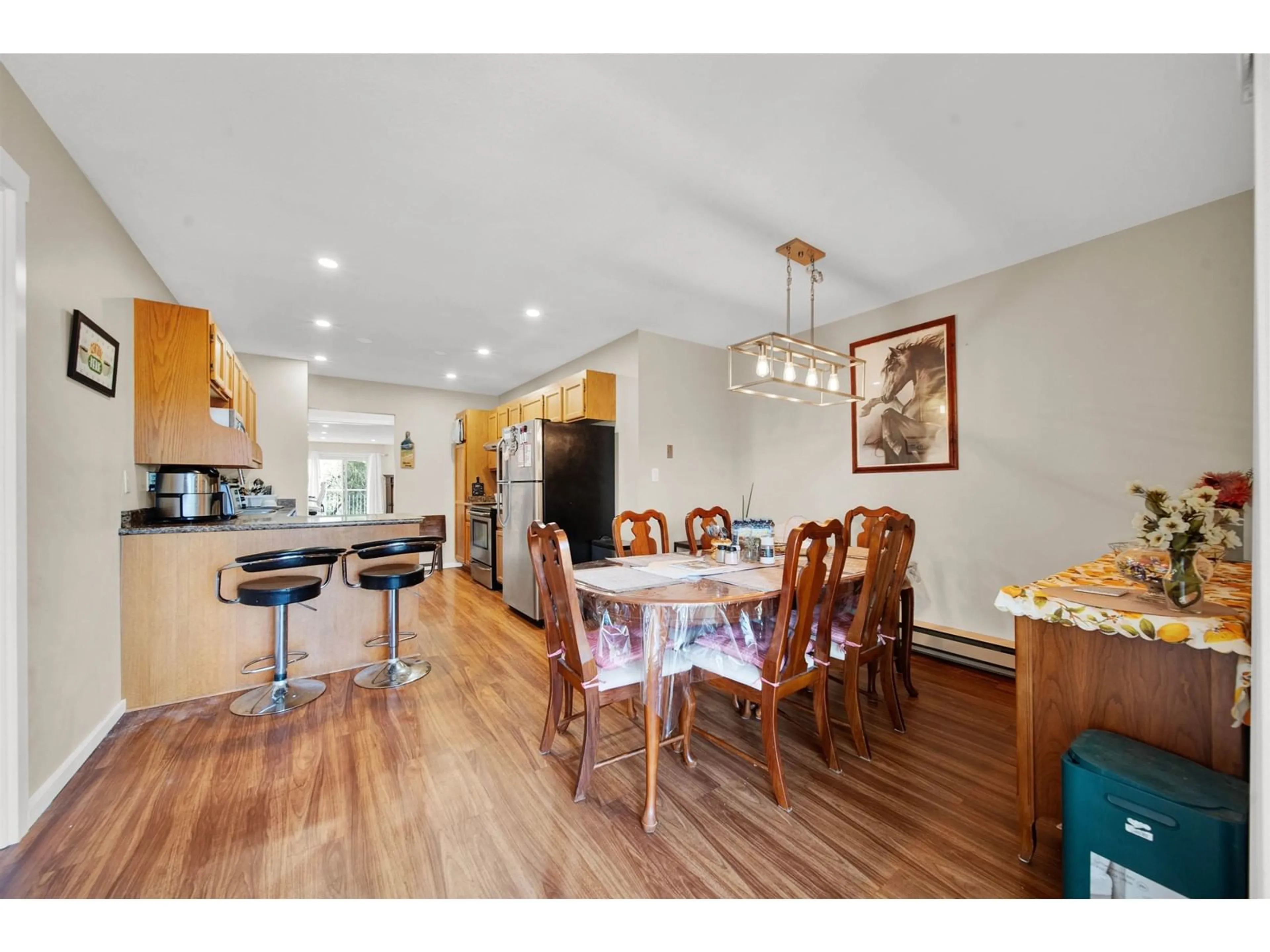Open concept kitchen, wood/laminate floor for 232 - 5641 201, Langley British Columbia V3A8A4