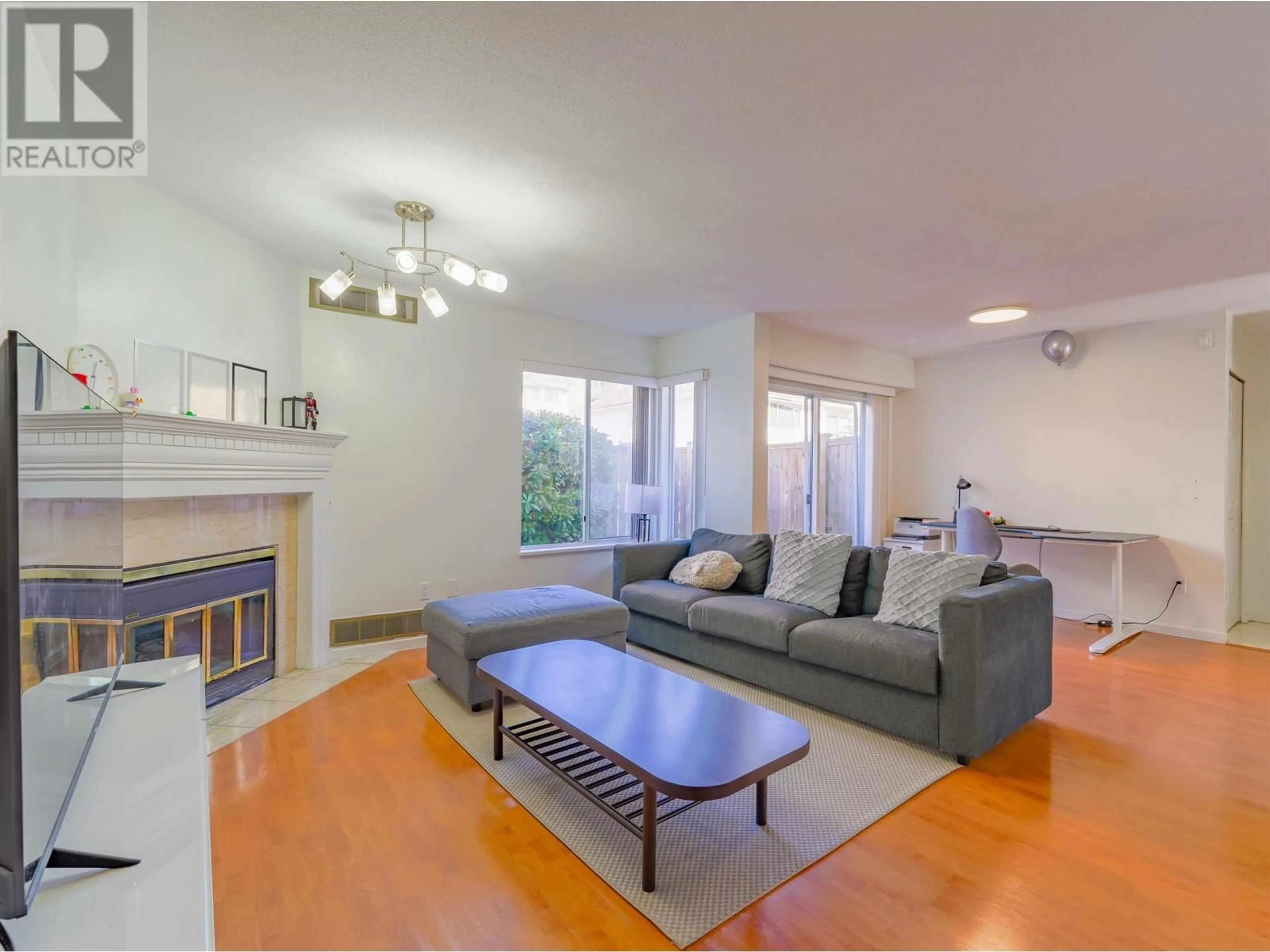 Living room with furniture, wood/laminate floor for 8 - 8220 BENNETT ROAD, Richmond British Columbia V6Y1N5