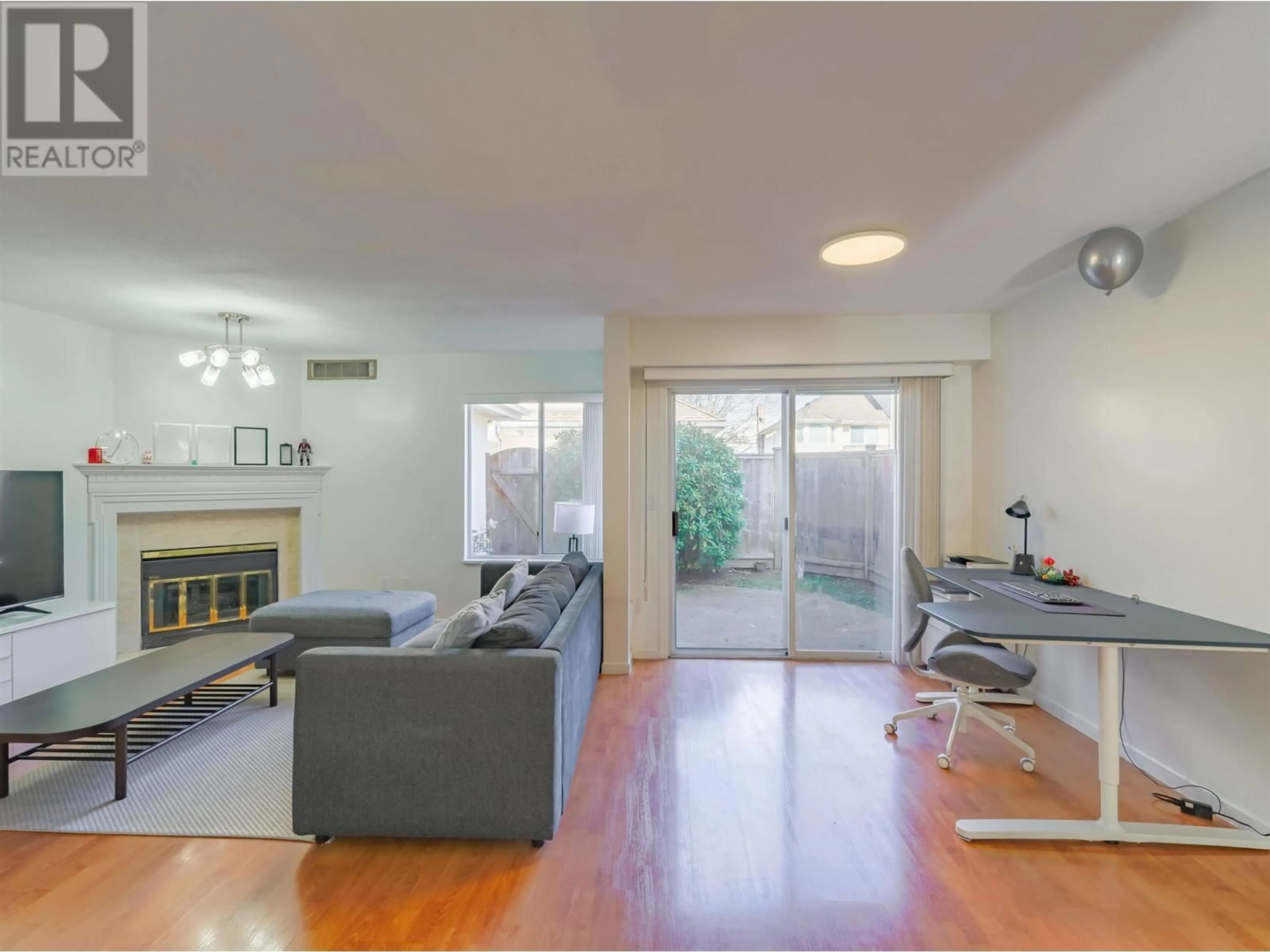 Living room with furniture, wood/laminate floor for 8 - 8220 BENNETT ROAD, Richmond British Columbia V6Y1N5