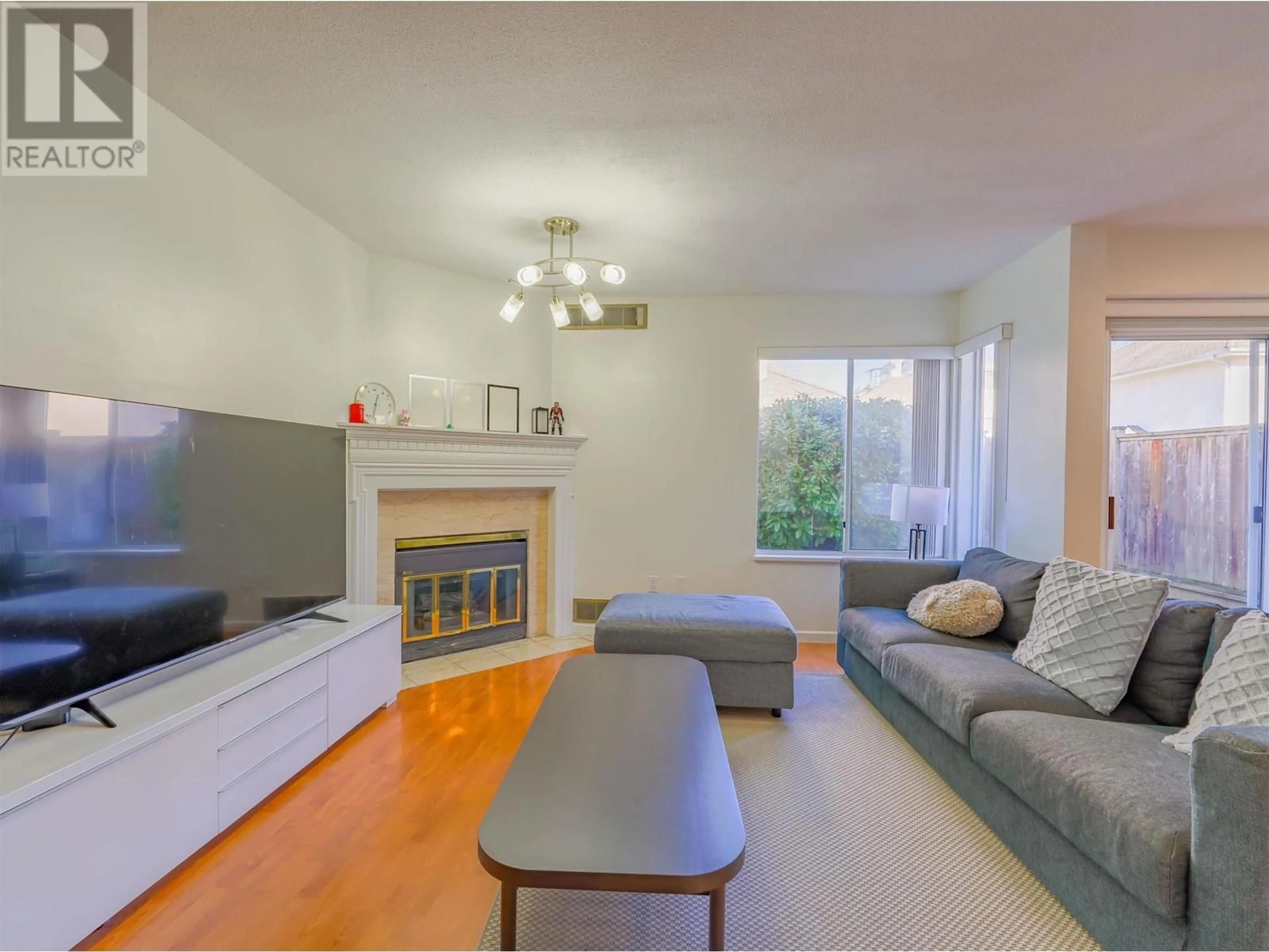 Living room with furniture, wood/laminate floor for 8 - 8220 BENNETT ROAD, Richmond British Columbia V6Y1N5