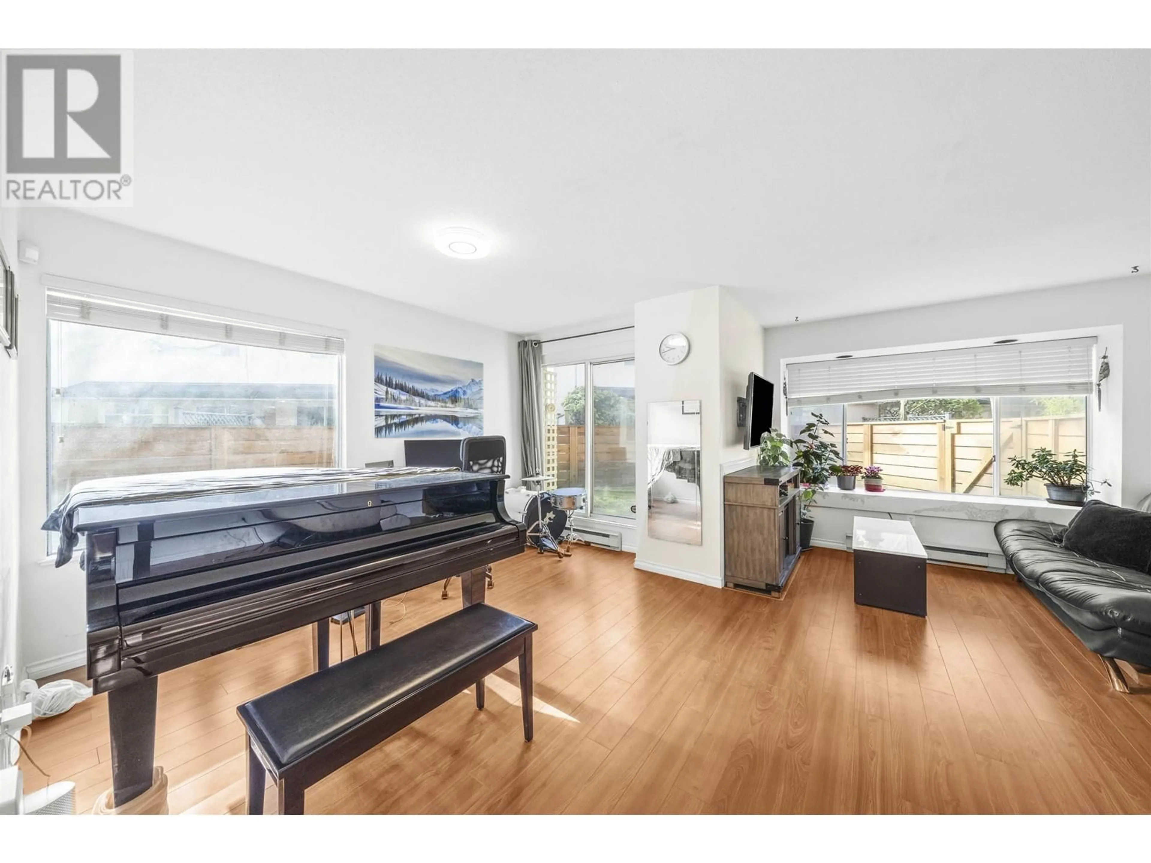 Living room with furniture, wood/laminate floor for 8 7611 MOFFATT ROAD, Richmond British Columbia V6Y1X9