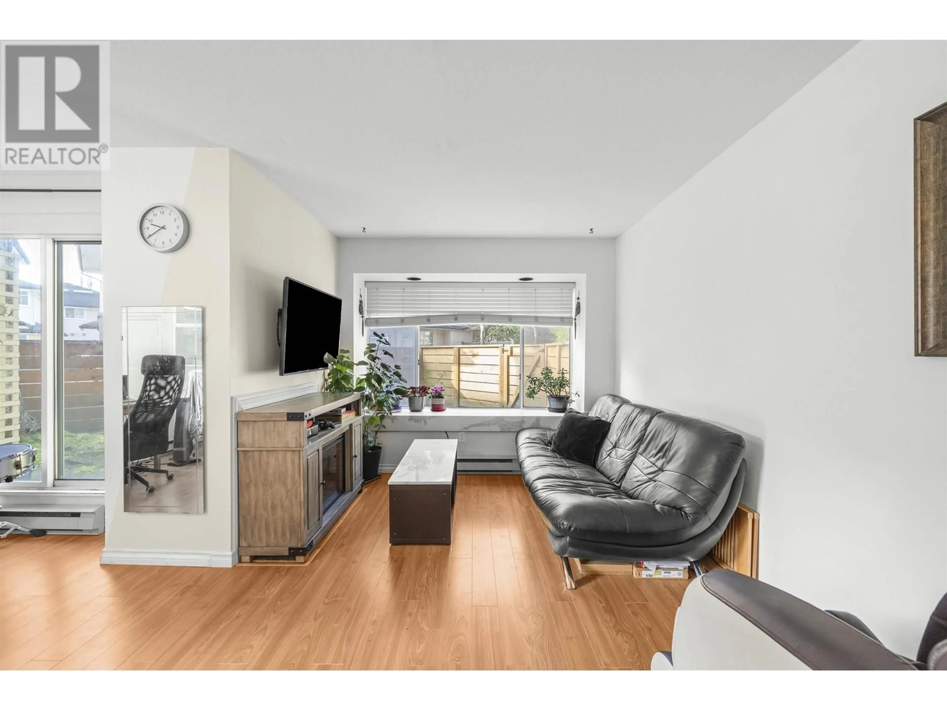 Living room with furniture, wood/laminate floor for 8 7611 MOFFATT ROAD, Richmond British Columbia V6Y1X9