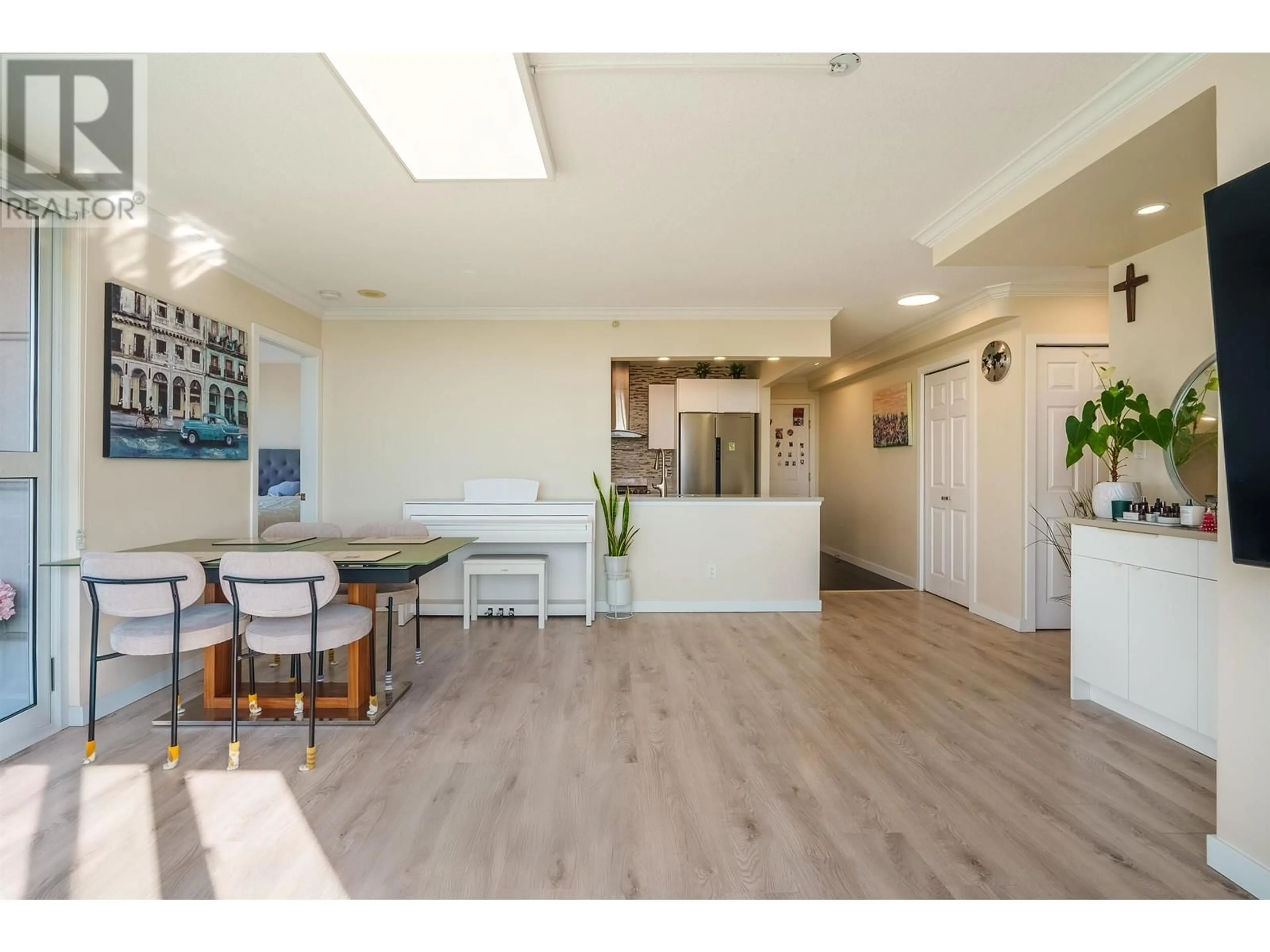 Open concept kitchen, wood/laminate floor for 2004 5189 GASTON STREET, Vancouver British Columbia V5R6C7