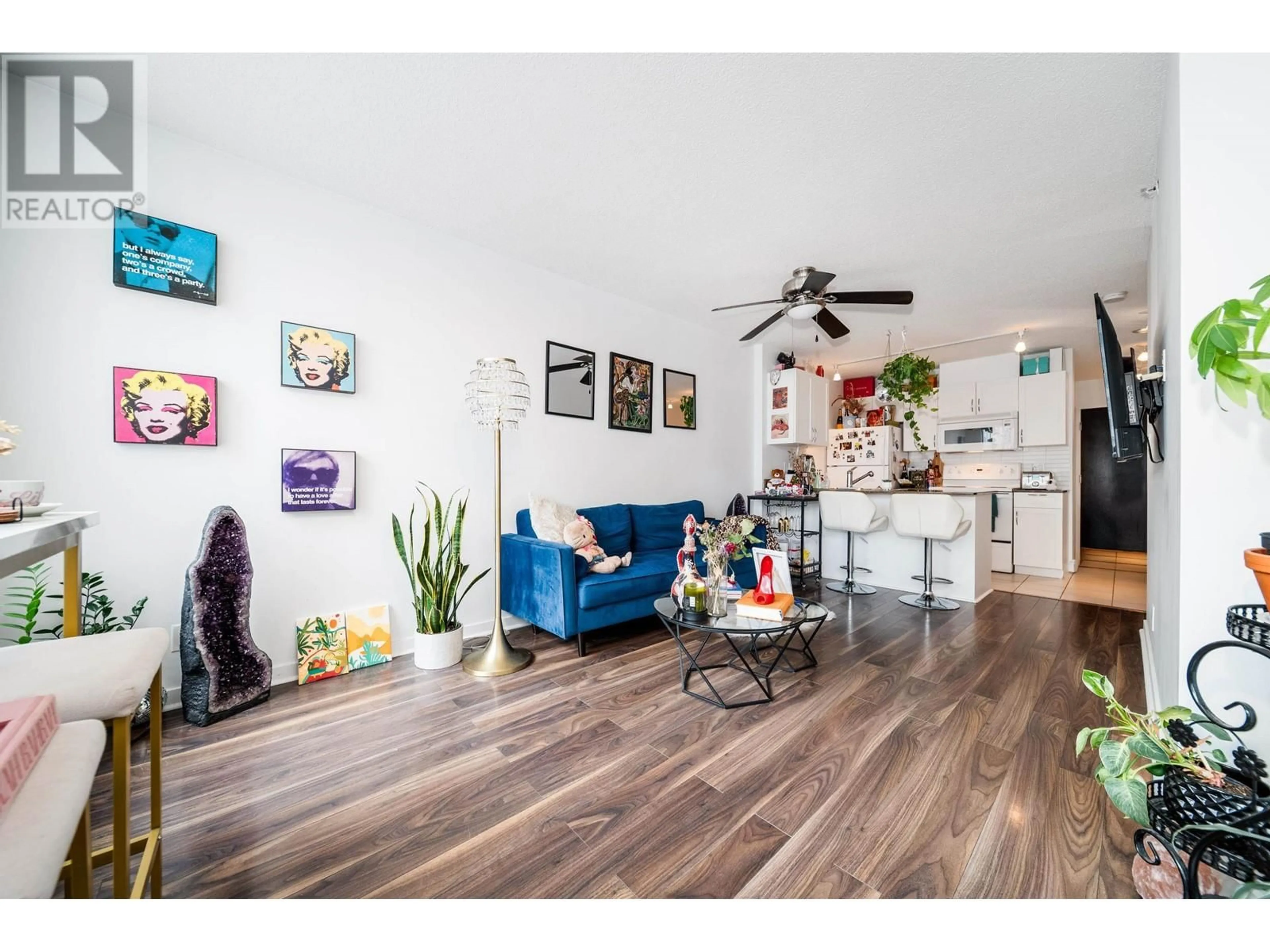 Living room with furniture, wood/laminate floor for 1907 938 SMITHE STREET, Vancouver British Columbia V6Z3H8