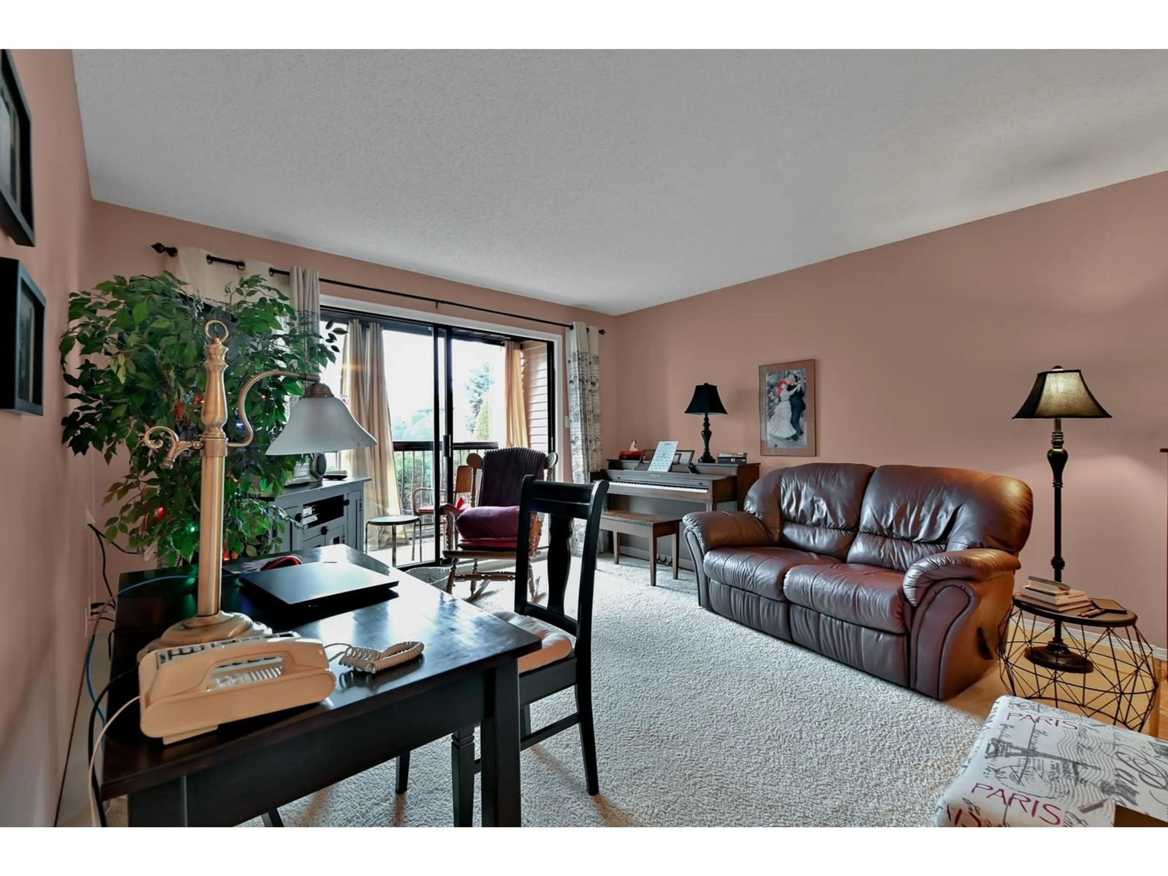Living room with furniture, wood/laminate floor for 102 - 32910 AMICUS, Abbotsford British Columbia V2S6G9