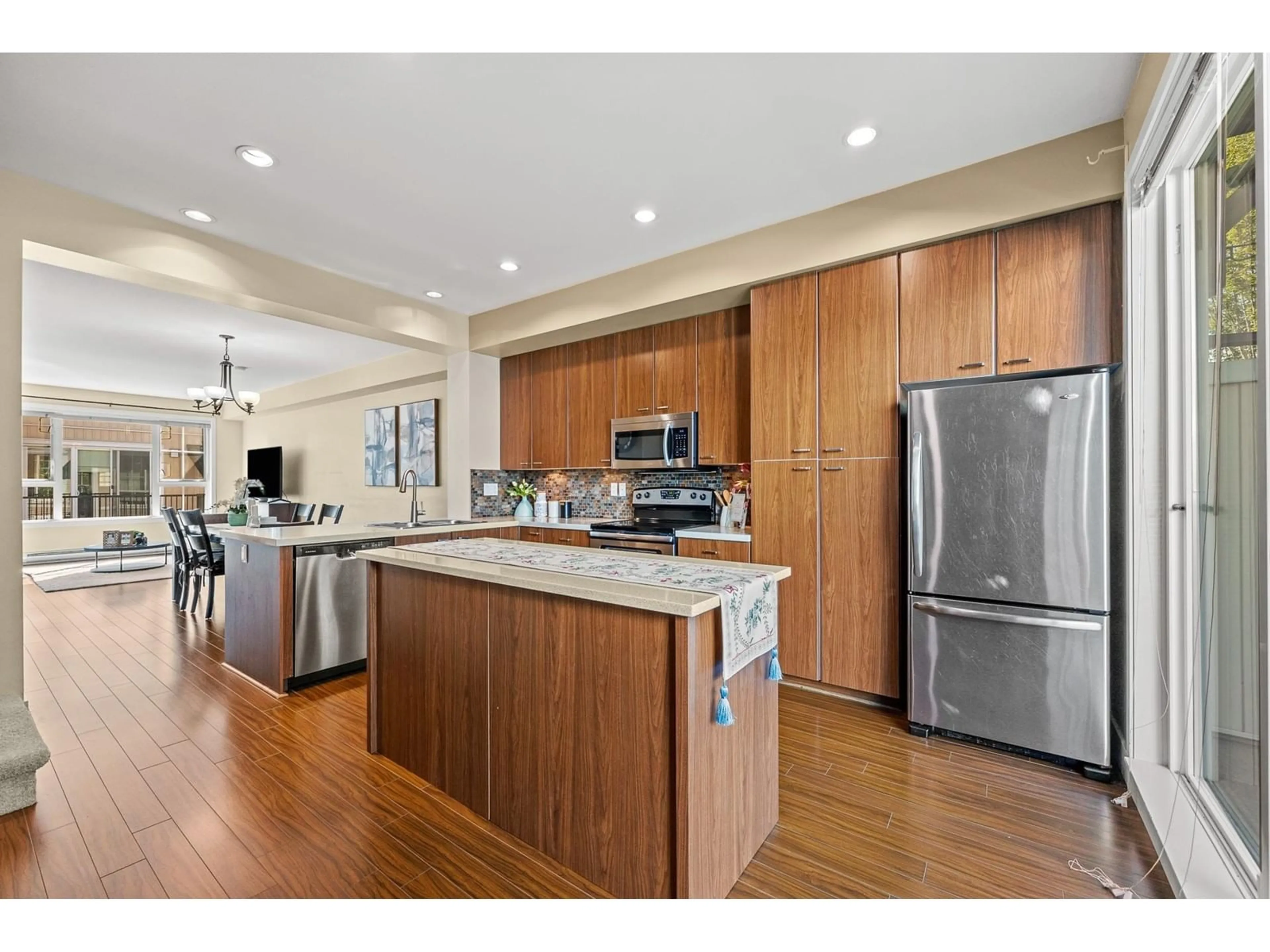 Open concept kitchen, wood/laminate floor for 55 2450 161A STREET, Surrey British Columbia V3Z8K4