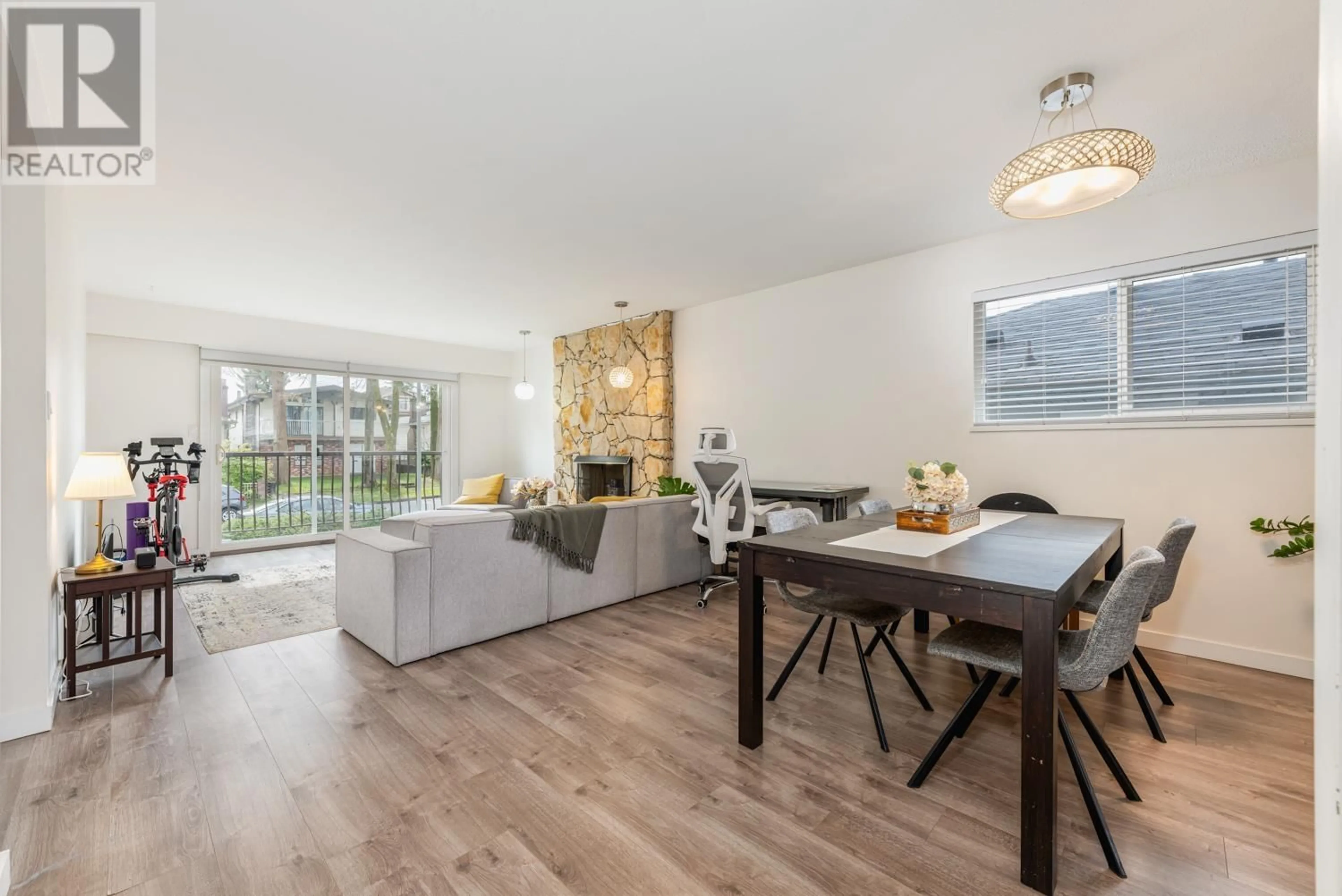 Living room with furniture, wood/laminate floor for 3661 E 27TH AVENUE, Vancouver British Columbia V5R1R3