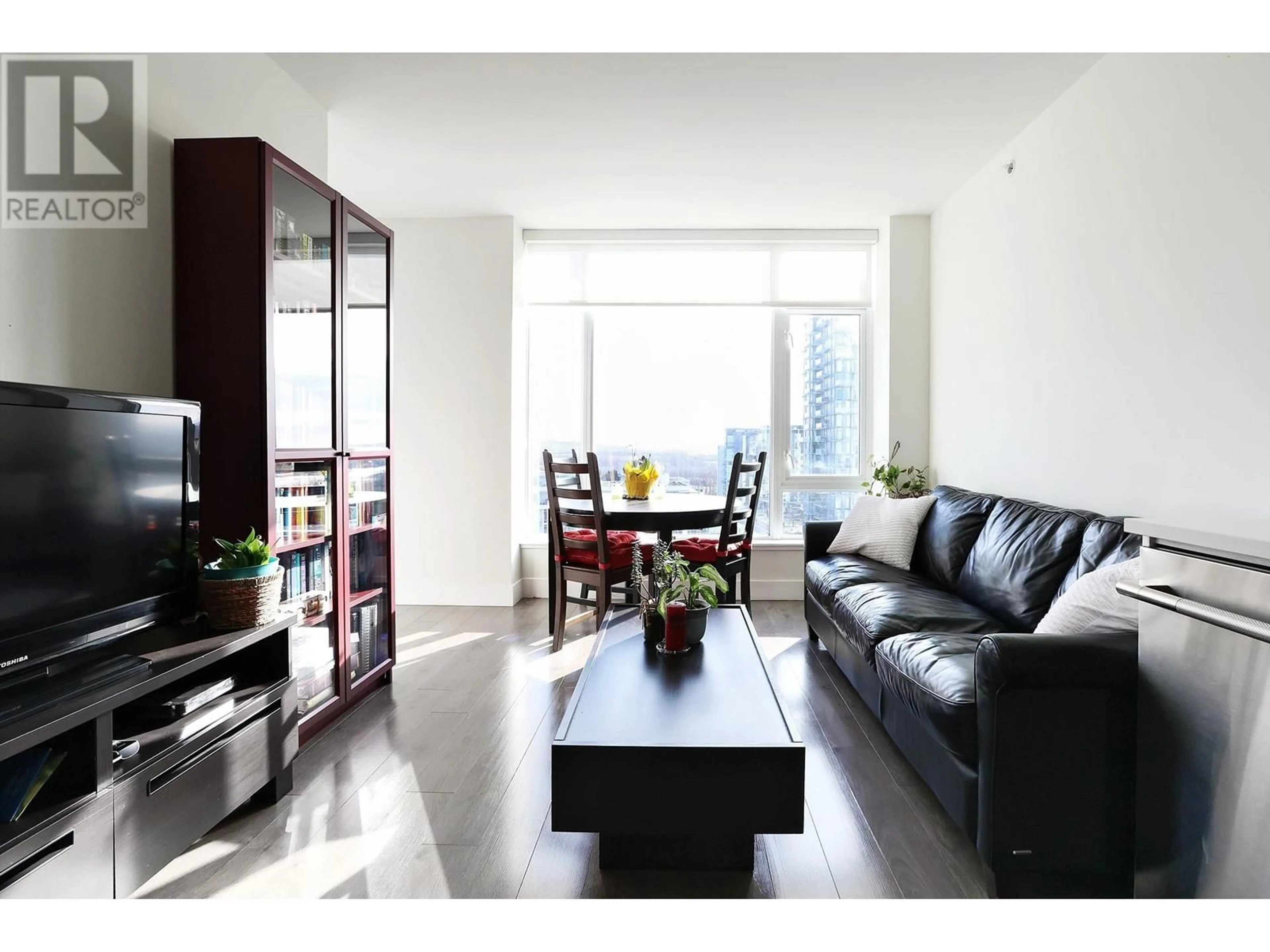 Living room with furniture, wood/laminate floor for 1402 8533 RIVER DISTRICT CROSSING, Vancouver British Columbia V5S0H2