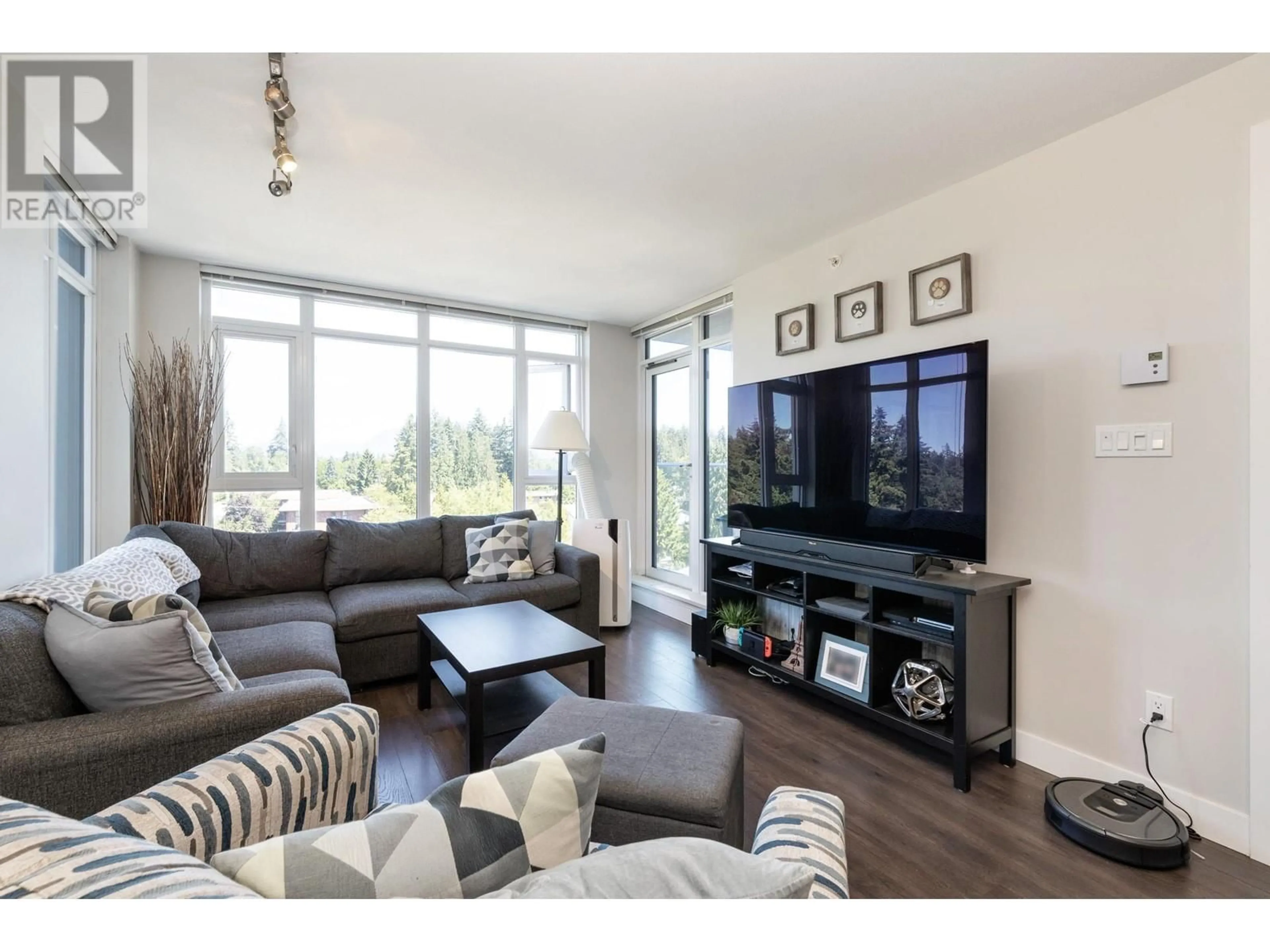 Living room with furniture, wood/laminate floor for 1005 958 RIDGEWAY AVENUE, Coquitlam British Columbia V3K0C5