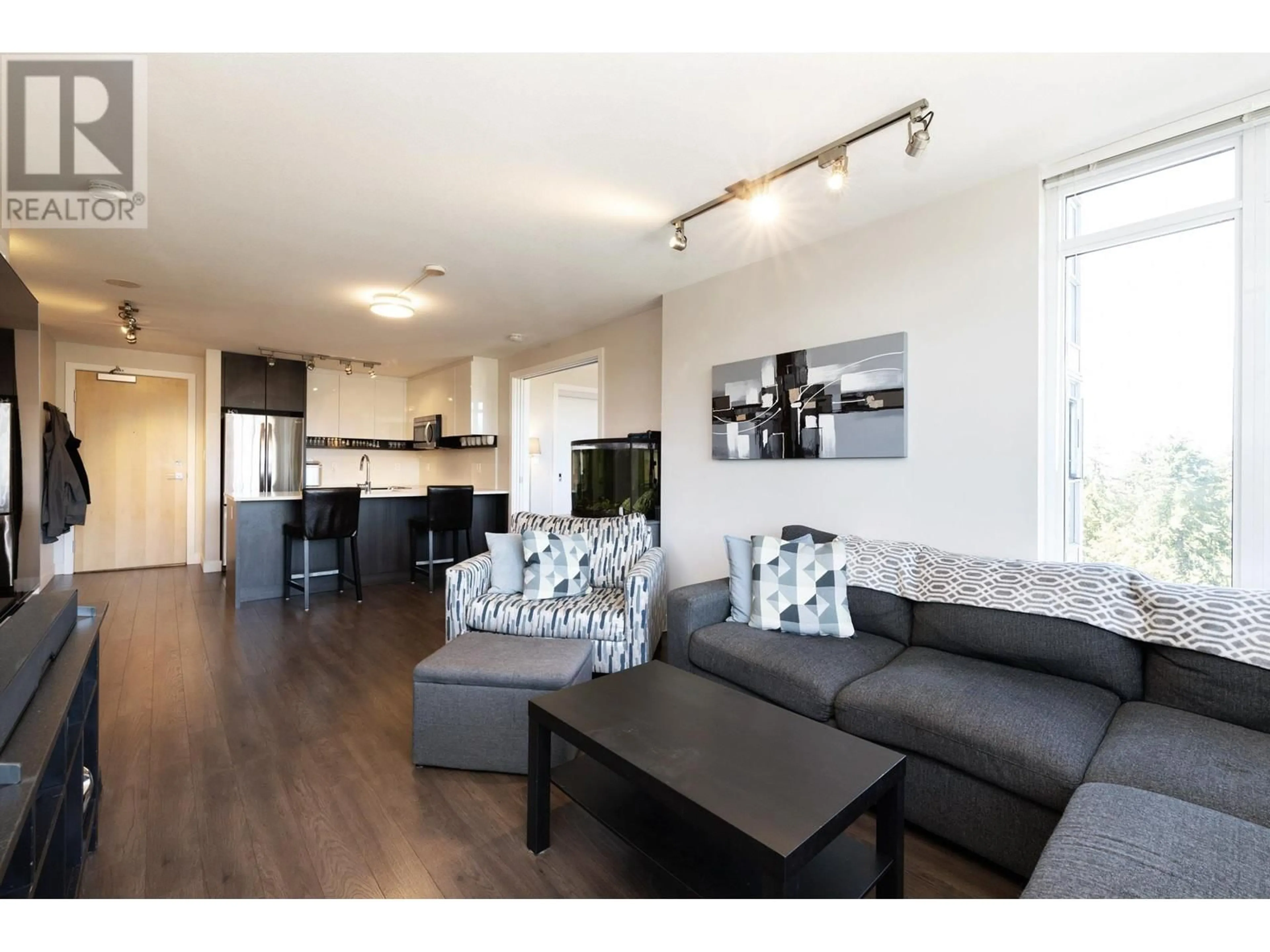 Living room with furniture, wood/laminate floor for 1005 958 RIDGEWAY AVENUE, Coquitlam British Columbia V3K0C5