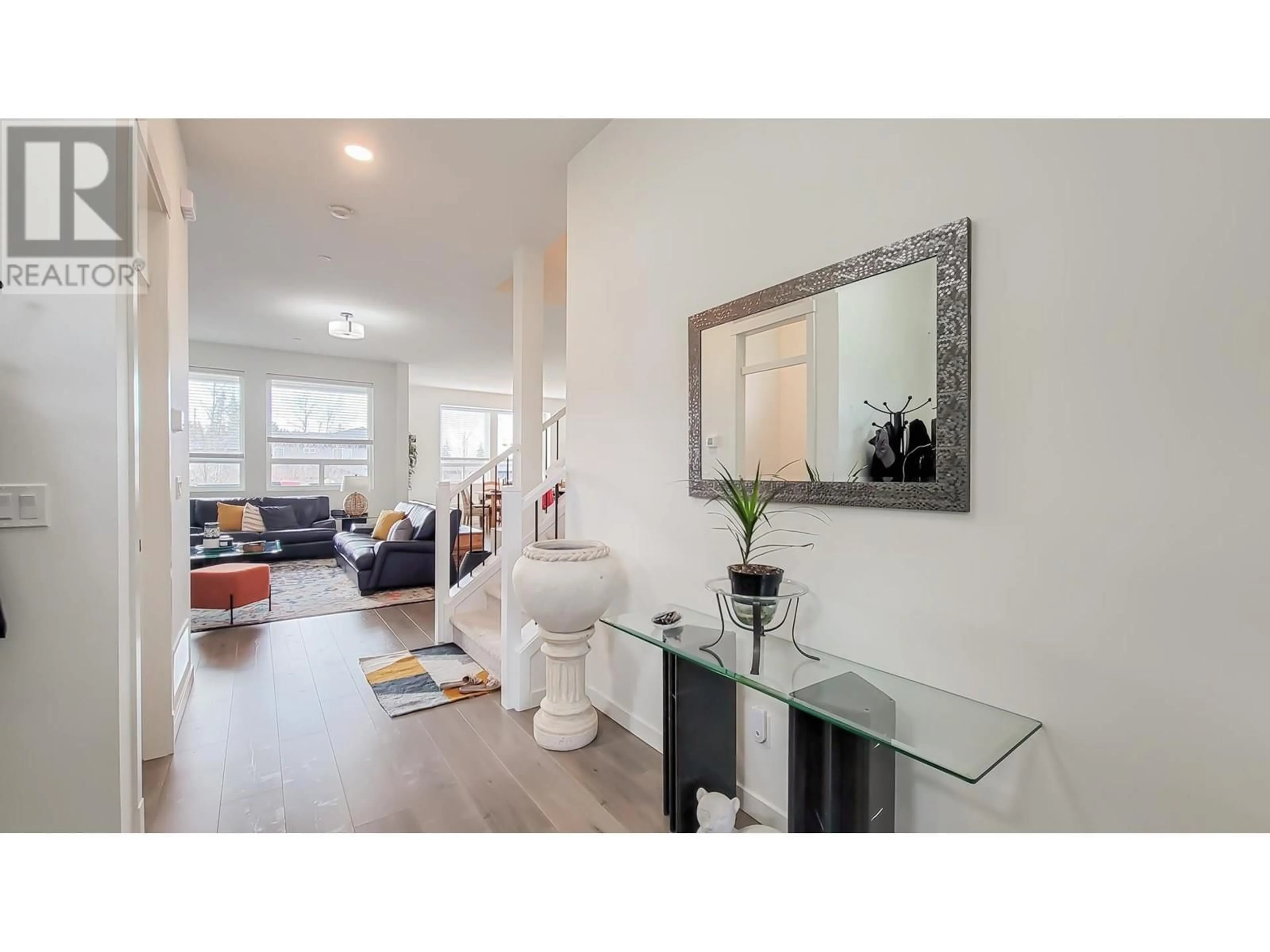 Living room with furniture, wood/laminate floor for 24670 106 AVENUE, Maple Ridge British Columbia V2W0A2