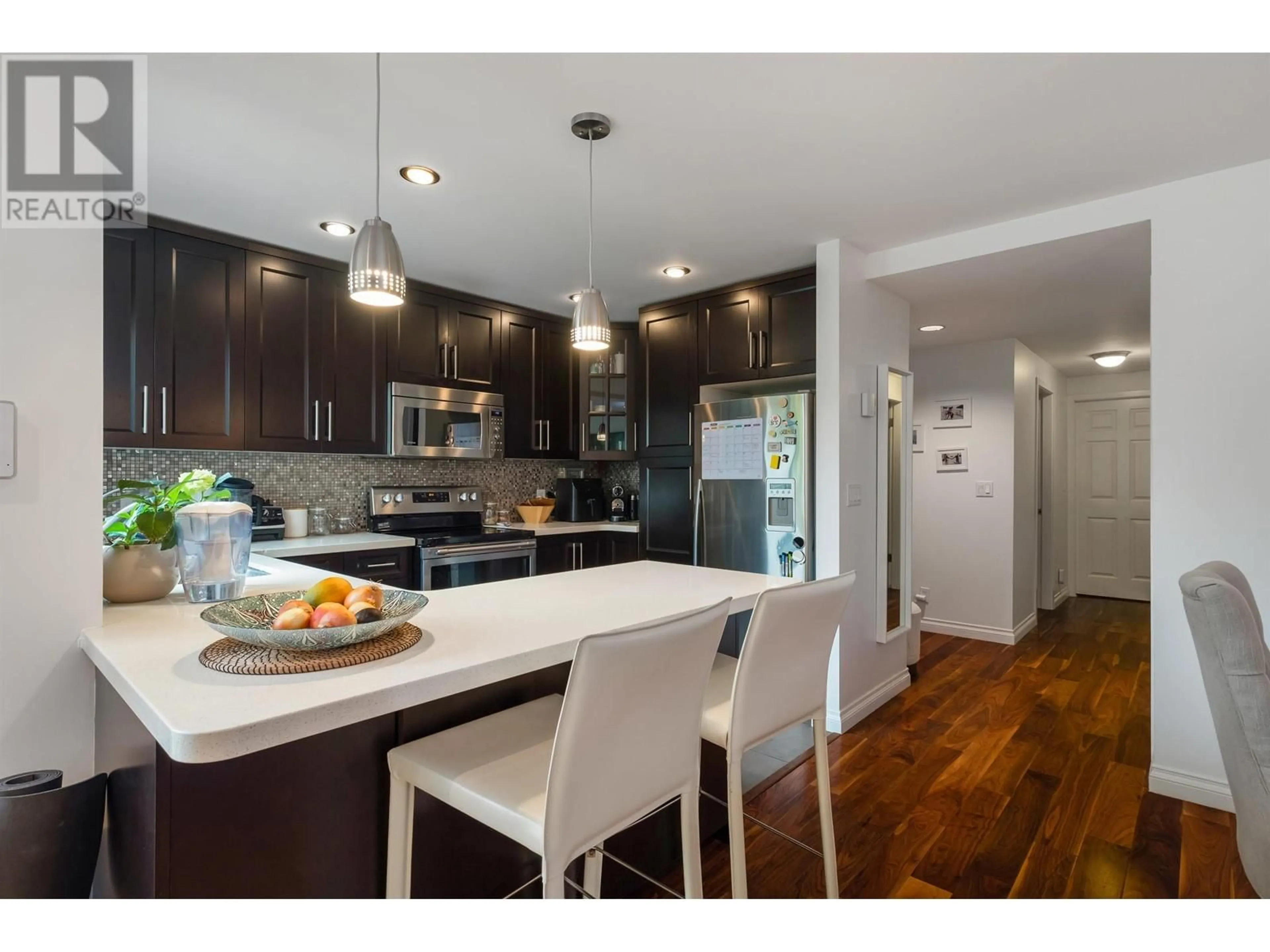 Open concept kitchen, wood/laminate floor for 2536 CORNWALL STREET, Vancouver British Columbia V6K1C2