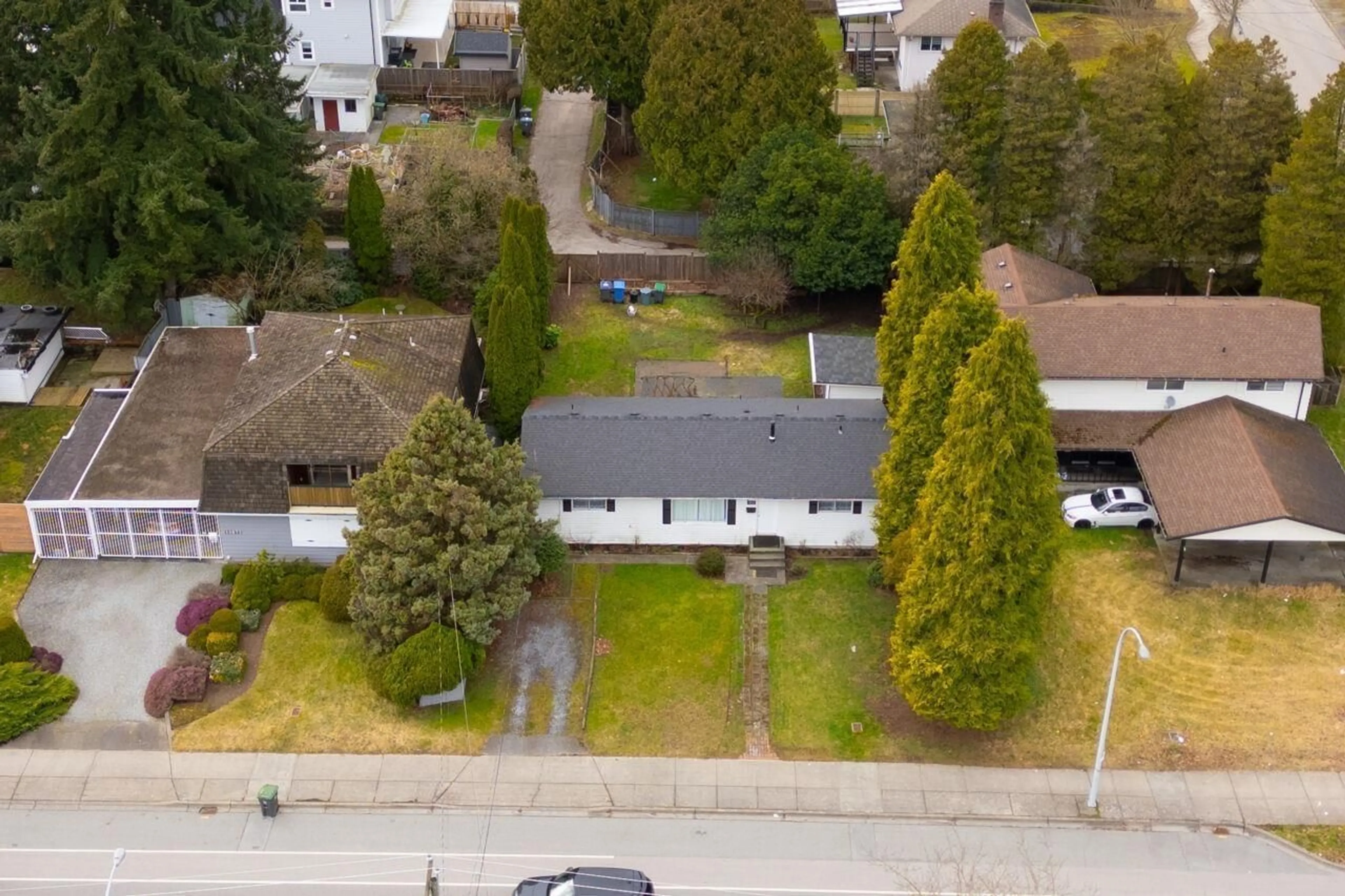 A pic from outside/outdoor area/front of a property/back of a property/a pic from drone, street for 10683 148 STREET, Surrey British Columbia V3R3X9