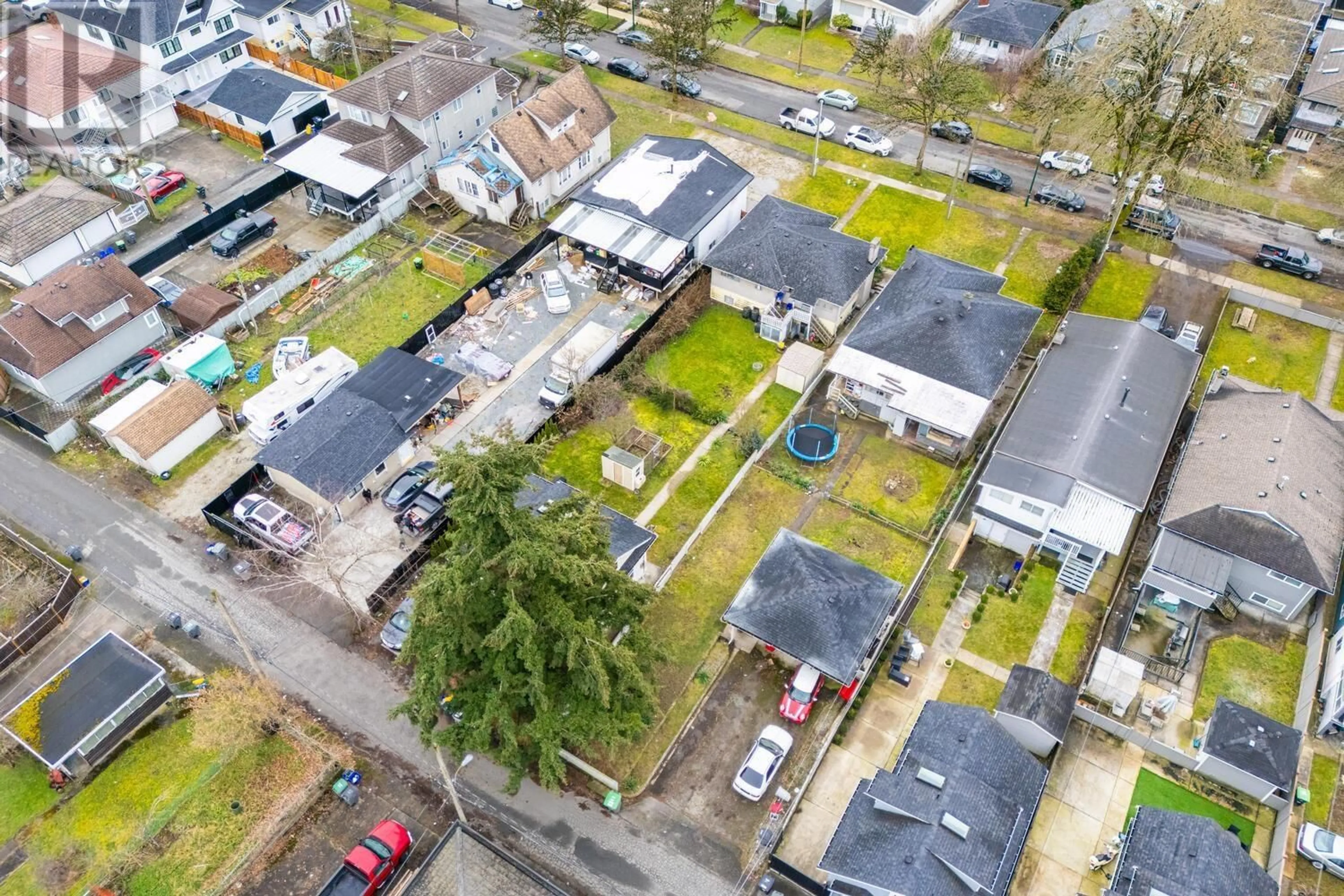 A pic from outside/outdoor area/front of a property/back of a property/a pic from drone, street for 1187 54TH AVENUE, Vancouver British Columbia V5X1M1