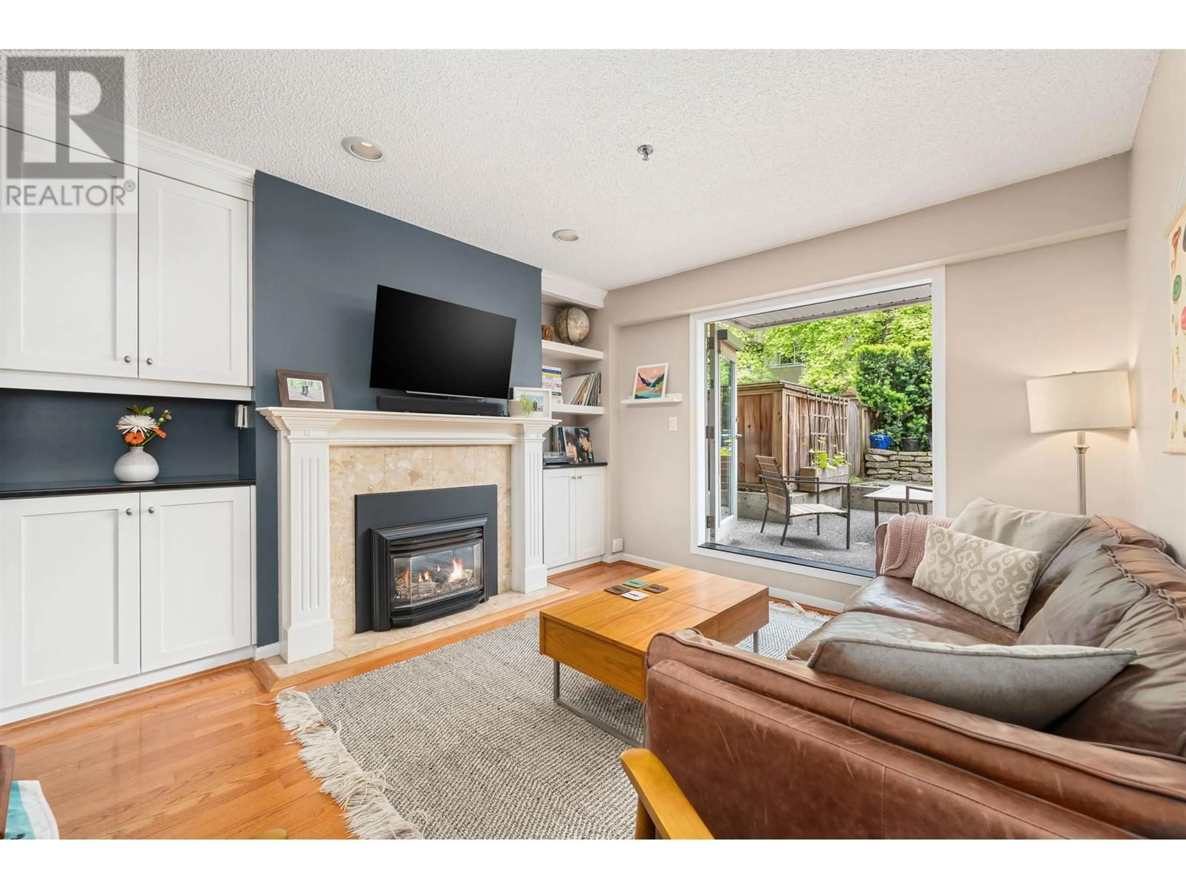 Living room with furniture, wood/laminate floor for 103 828 W 14TH AVENUE, Vancouver British Columbia V5Z1R1