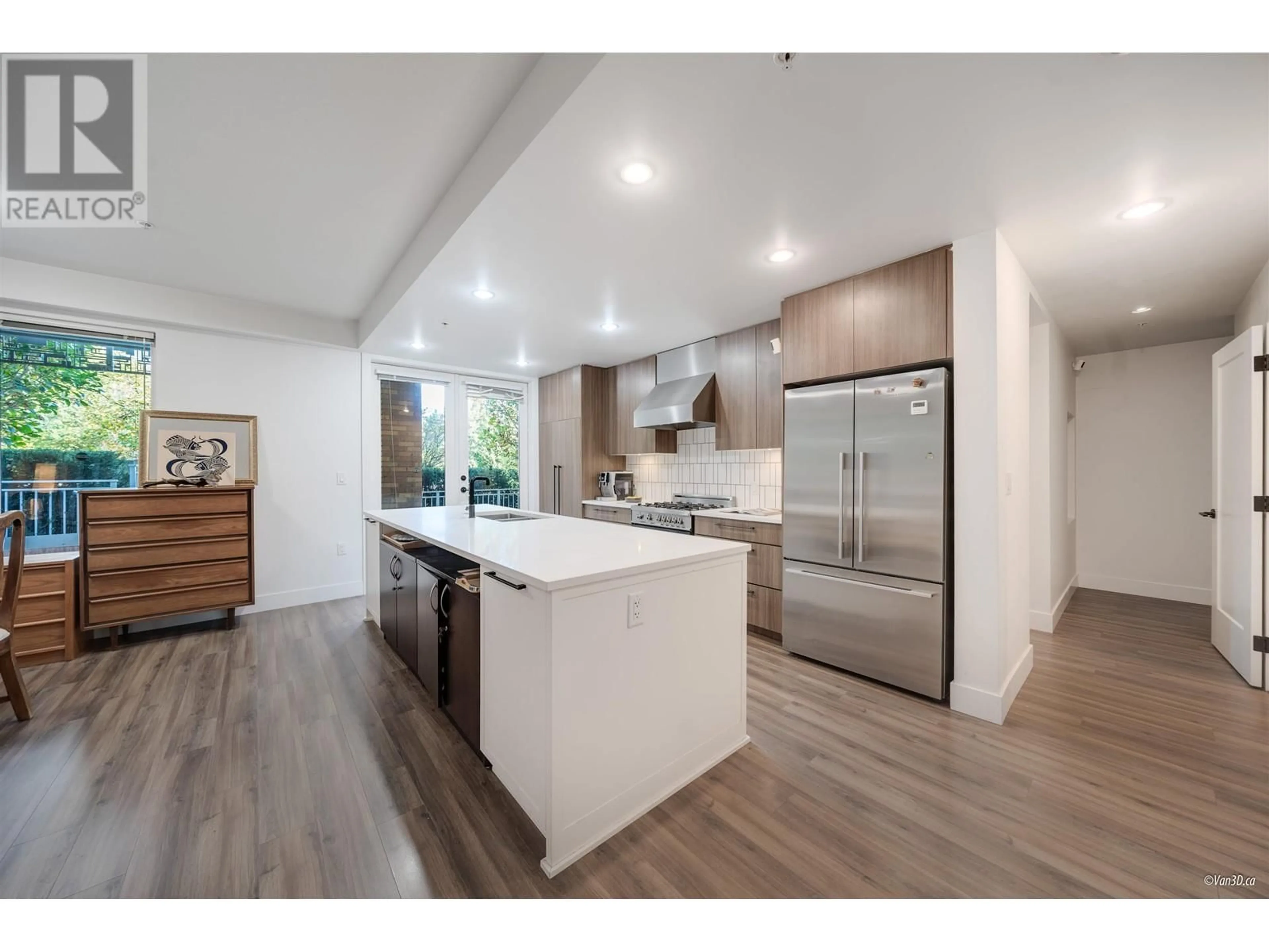 Open concept kitchen, wood/laminate floor for 106 - 6933 CAMBIE STREET, Vancouver British Columbia V6P0J1